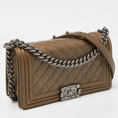 Borsa Chanel Greene & Greene in pelle trapuntata con patta media per ragazzo