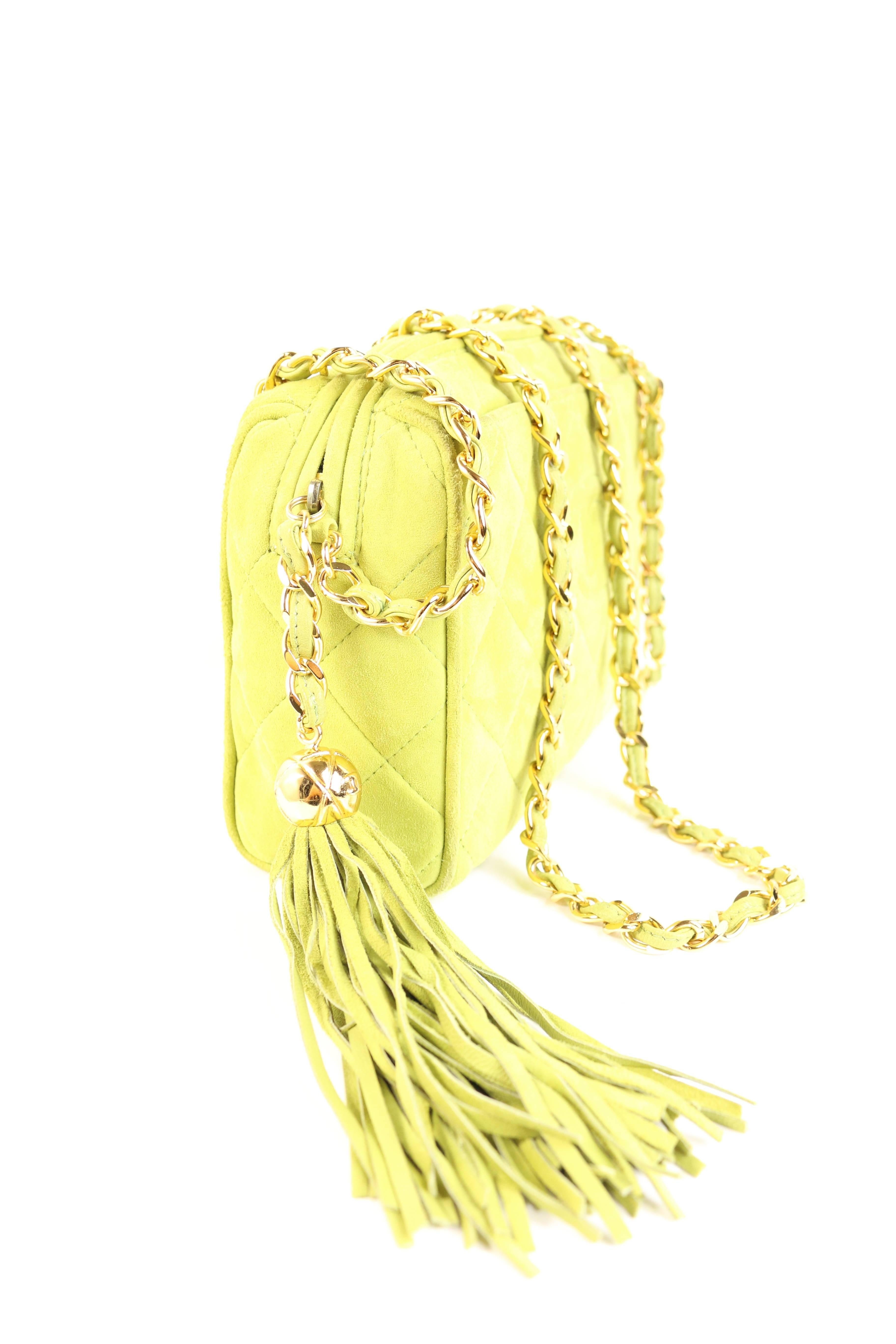 - Apple green quilted suede with embossed CC logo from 1994 to 1996 collection. 

- Featuring gold hardware chain shoulder strap. 

- Golden ball hardware tassel. 

- White interior leather. 

- One interior slip pocket. 

- One exterior slip