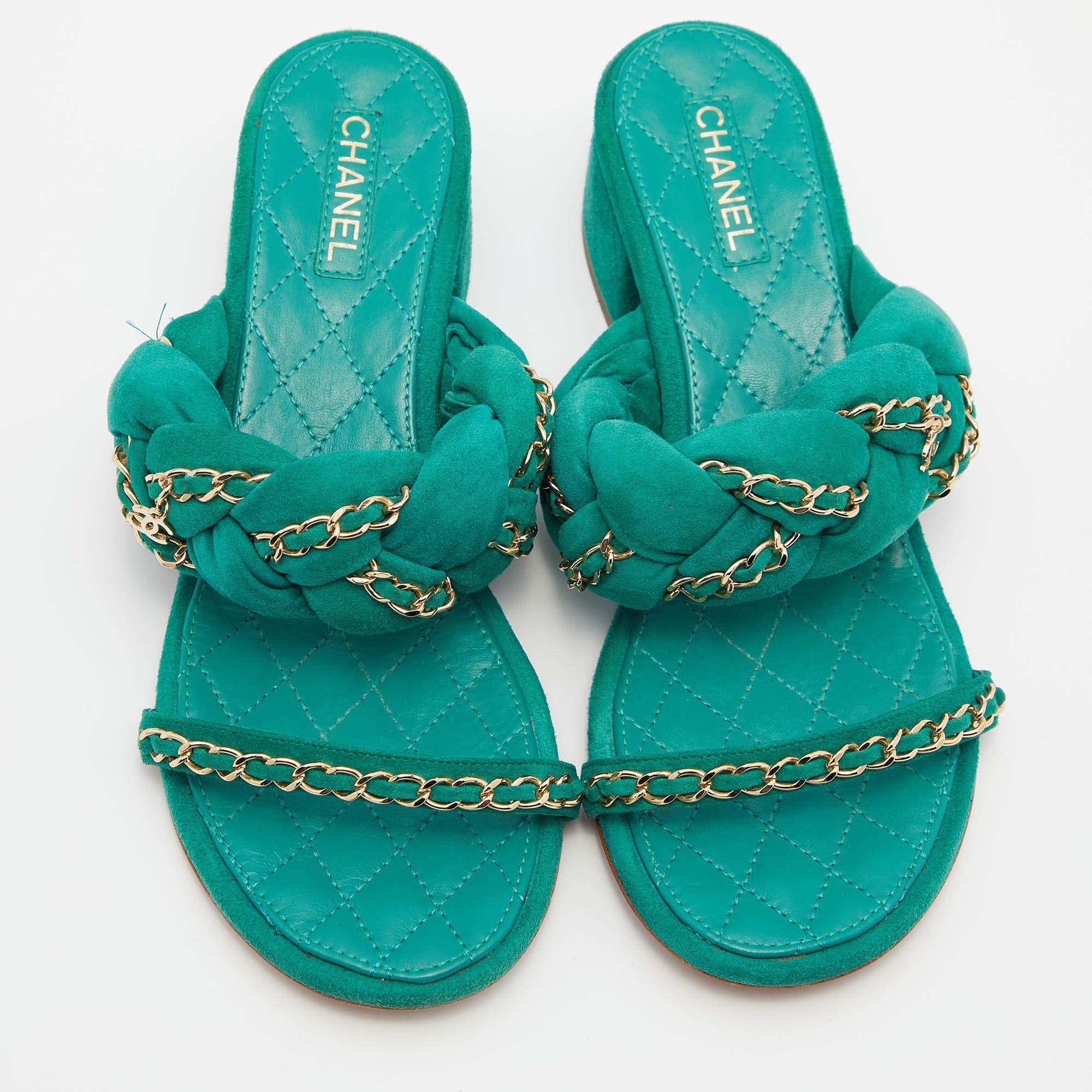 Comfort coupled with fashion creates wonders and these sandals from Chanel are a true example of that. These green sandals are crafted from suede and feature an open-toe silhouette. They flaunt two gold-tone chain embellished straps, one of which
