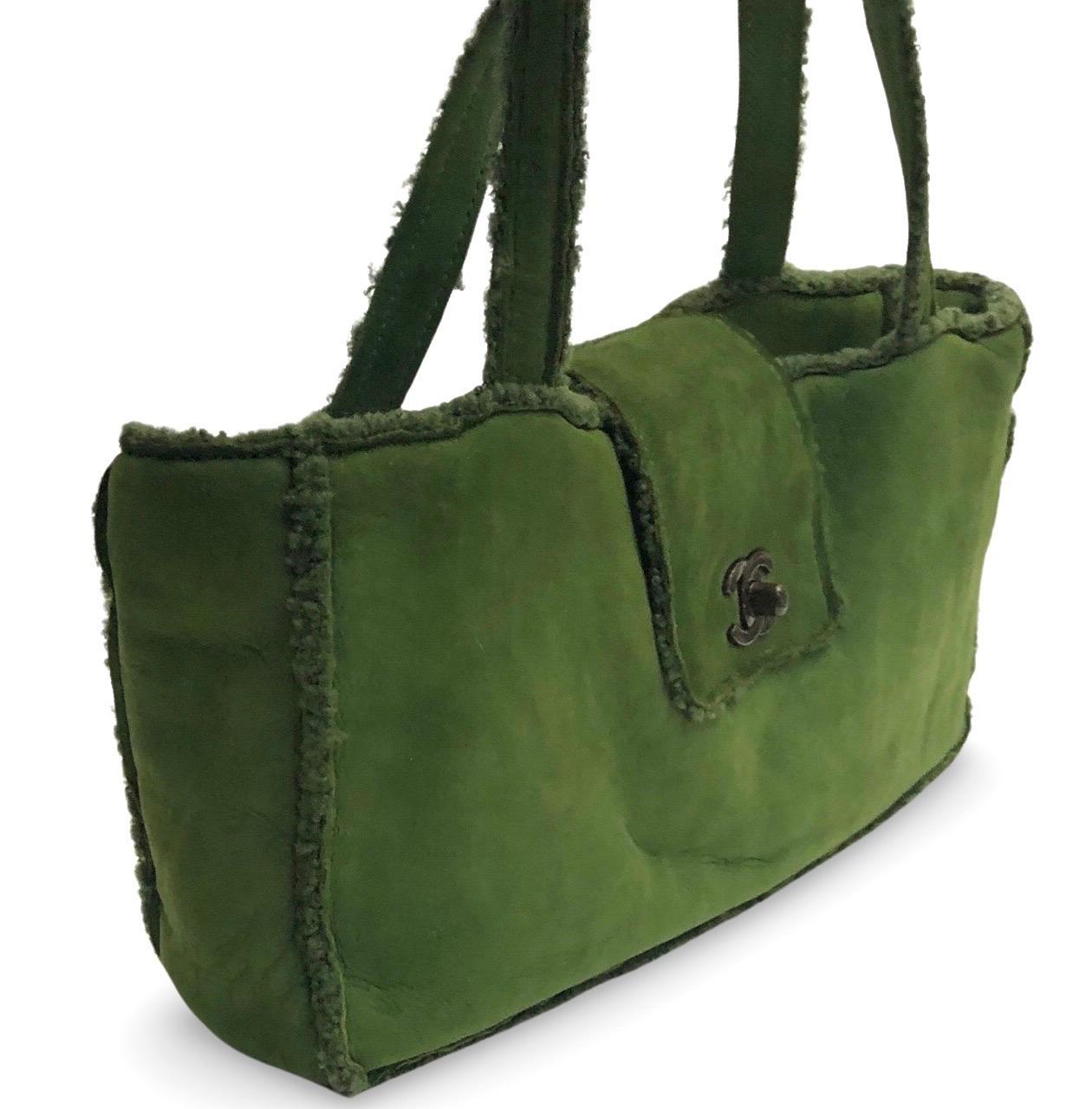 - Chanel green suede shoulder shoulder handbag from 1998 collection. 

- Featuring green shearling mouton trim overall. 

- CC turnlock flap closure. 

- Interior zip pocket. 

- Length: 32cm. Height: 16cm. Width: 7.5cm. Handle Drop: 18cm