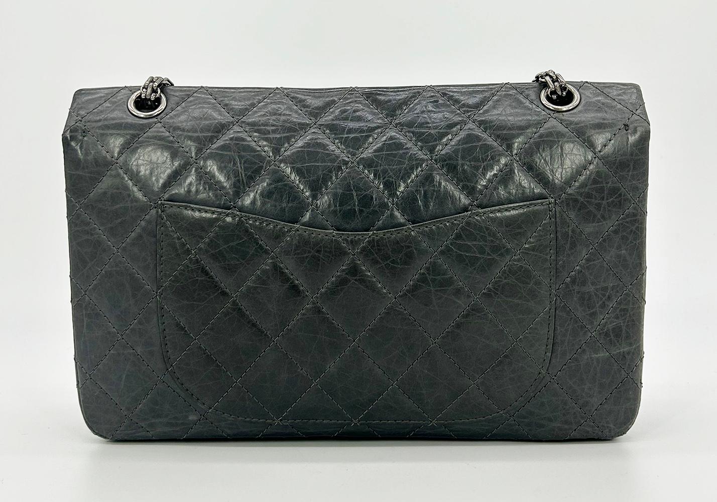 Chanel Grey Aged Calfskin Anniversary 2.55 Reissue 227 Double Flap Bag in good condition. Quilted grey aged calfskin exterior trimmed with ruthenium hardware and silver chain shoulder strap. Front mademoiselle twist lock closure opens via double