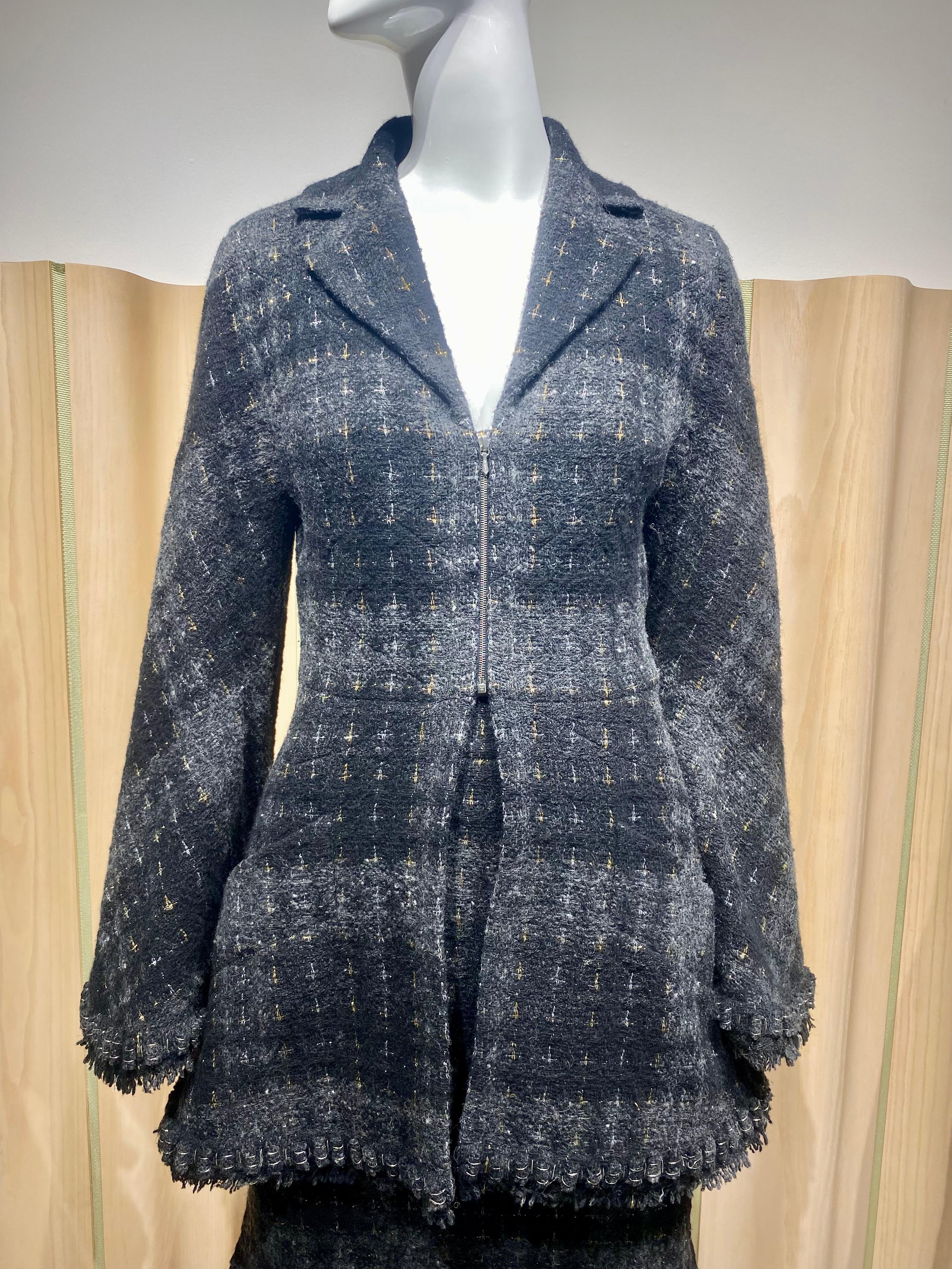 2008 Chanel Black , Grey wool Jacket Skirt suit.
- silver and gold thread . Jacket and skirt lined in beautiful silk with camellia print 
Jacket has bell sleeve. 
Metal zipper. 
marked size 36, Fit US 2 or 4