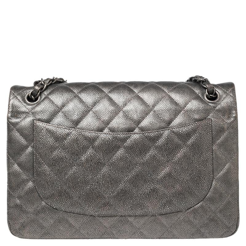 We're bringing Chanel's iconic Classic Flap bag to your closet with this creation. Beautifully crafted from Caviar leather and covered in the diamond quilt, it bears the signature label within the leather interior and the iconic CC turn-lock on the