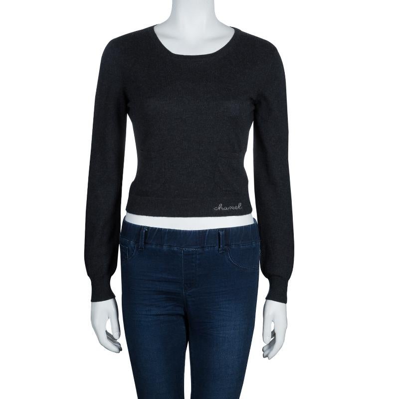 Pair this chic sweater from Chanel with your denim to get an apt outdoorsy look. Knitted with cashmere, this grey sweater features scoop neck, a straight hem, and long sleeves.

Includes: The Luxury Closet Packaging

