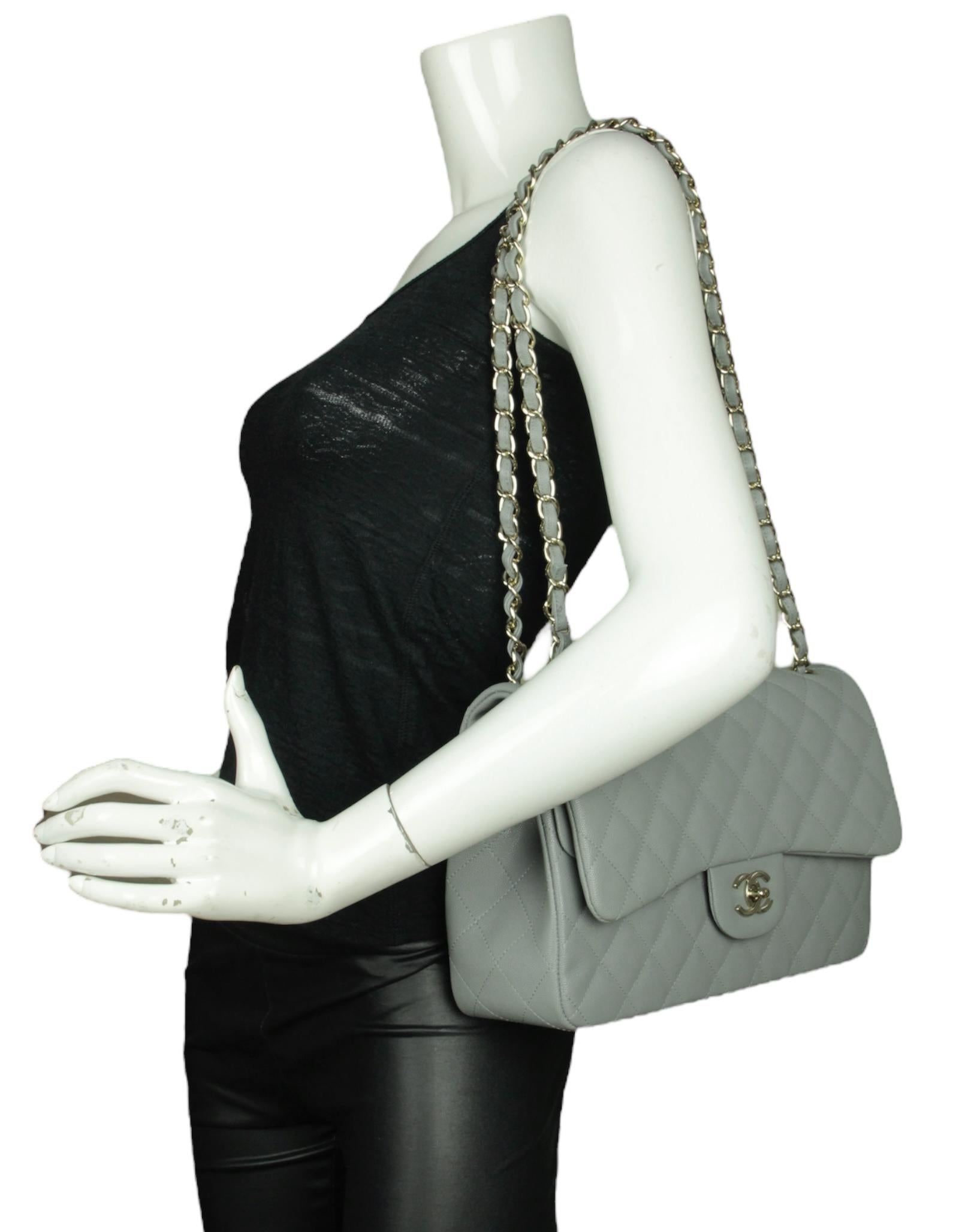 Chanel Grey Caviar Leather Quilted Classic Double Flap Jumbo Bag

Made In: Italy
Color: Grey 
Hardware: Champagne goldtone
Materials: Caviar Leather
Lining: Smooth leather
Closure/Opening: Top flap with CC turnlock
Exterior Pockets: One flat
