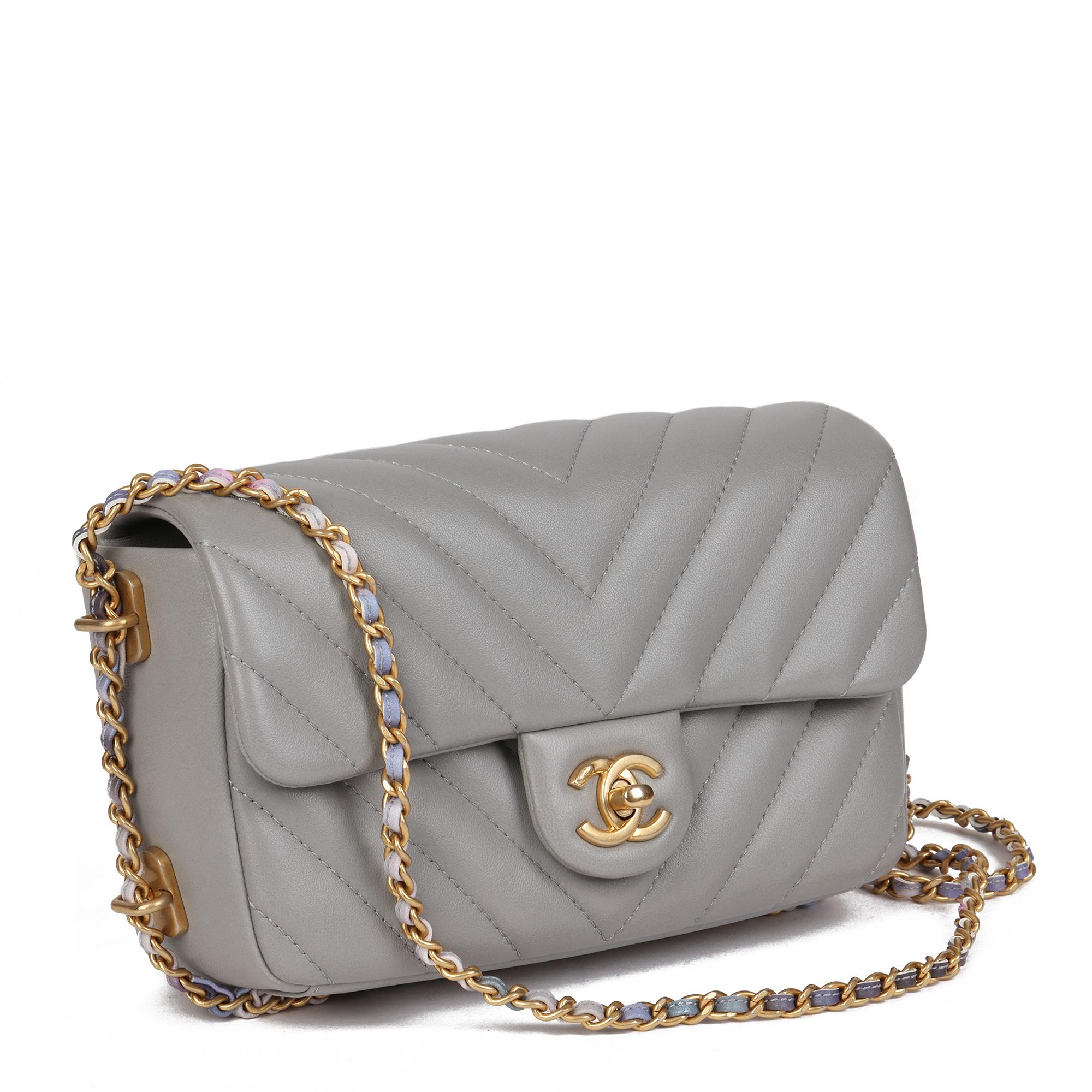 CHANEL
Grey Chevron Quilted Lambskin Chain Around Mini Rectangular Flap Bag

Serial Number: 25301129
Age (Circa): 2018
Accompanied By: Chanel Dust Bag, Box, Authenticity Card, Protective Felt, Care Booklet
Authenticity Details: Authenticity Card,