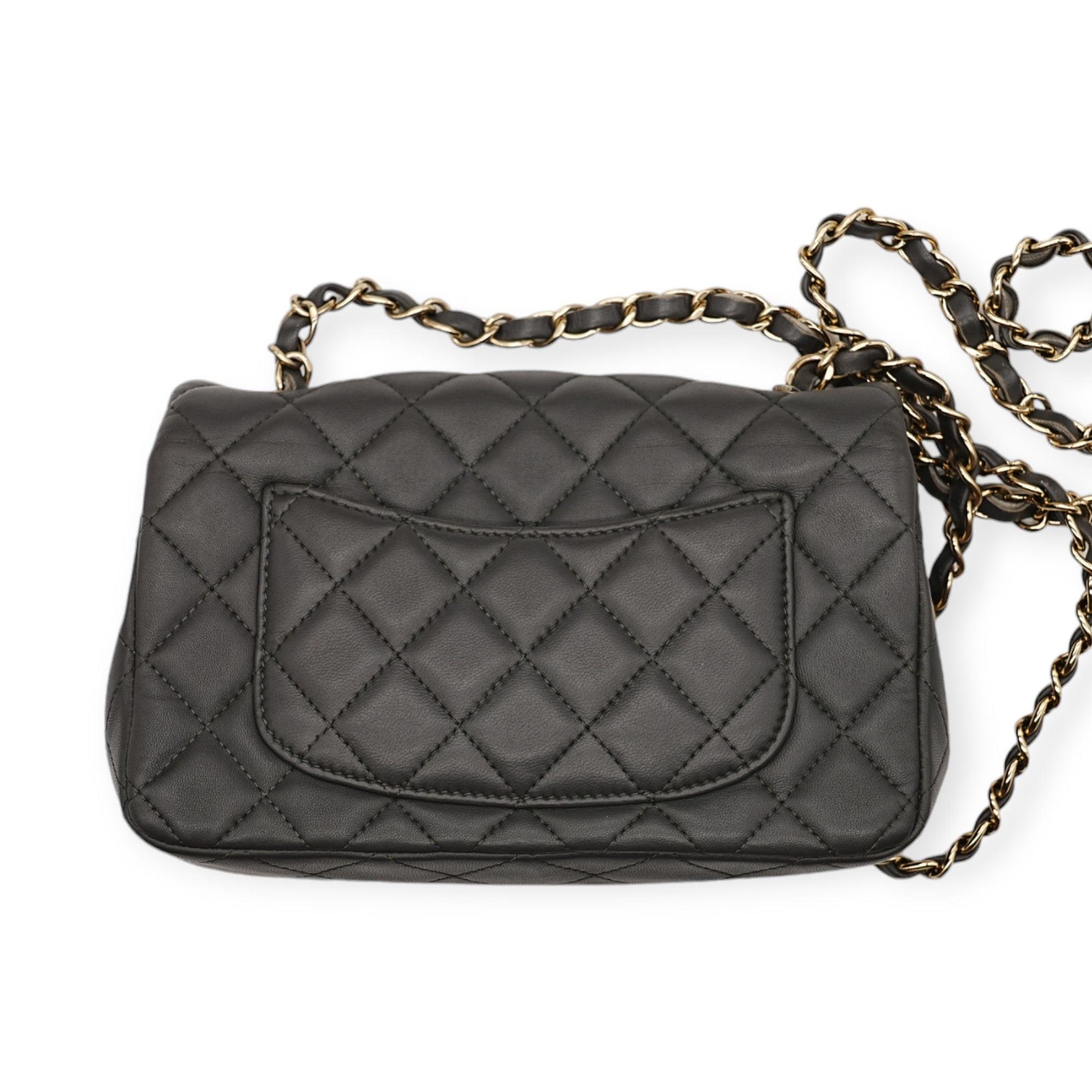 The Chanel Classic Mini Rectangular Flap Bag is crafted with soft grey lambskin leather, it exudes understated elegance, while the gold-tone hardware adds a refined touch of sophistication. The compact design is both versatile and iconic, making it