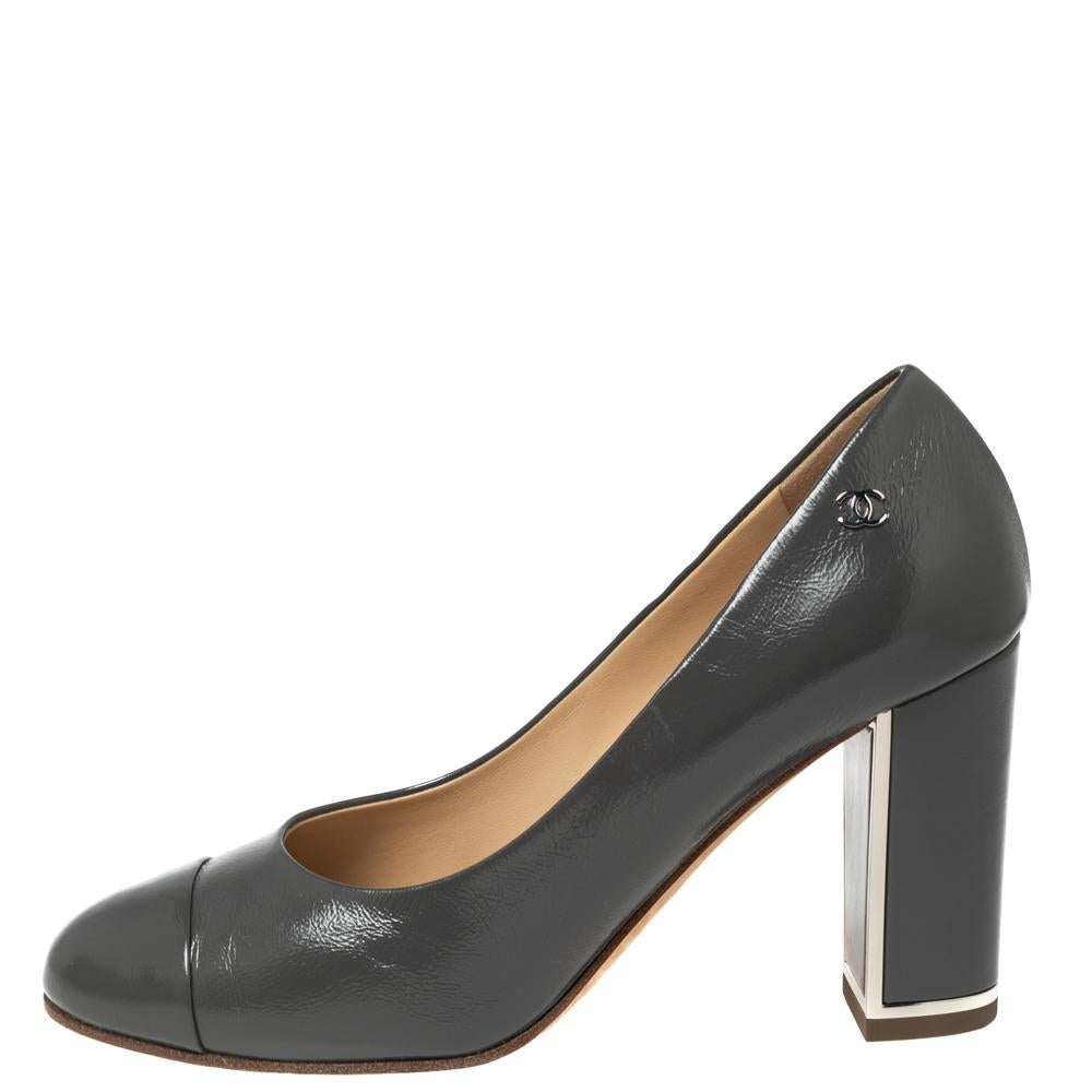 These pumps from the House of Chanel are truly elegant and poised. They are made from grey leather on the exterior and showcase cap toes and block heels. A petite silver-toned logo is used to embellish their upper. Wear these Chanel pumps and look