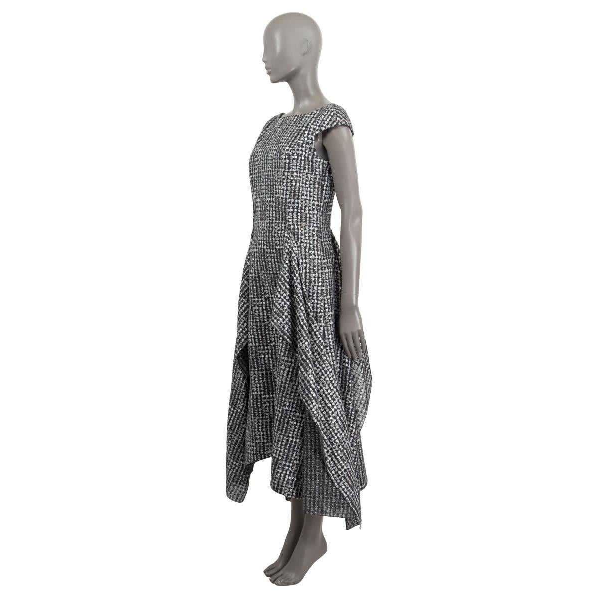 100% authentic Chanel sequin embellished asymmetrical midi dress in silver and charcoal linen (52%), polyester (37%), cotton (7%) and polyamide (4%). Features cap sleeves and a silver 'CC' emblem at the front. Opens with a zipper and a hook at the