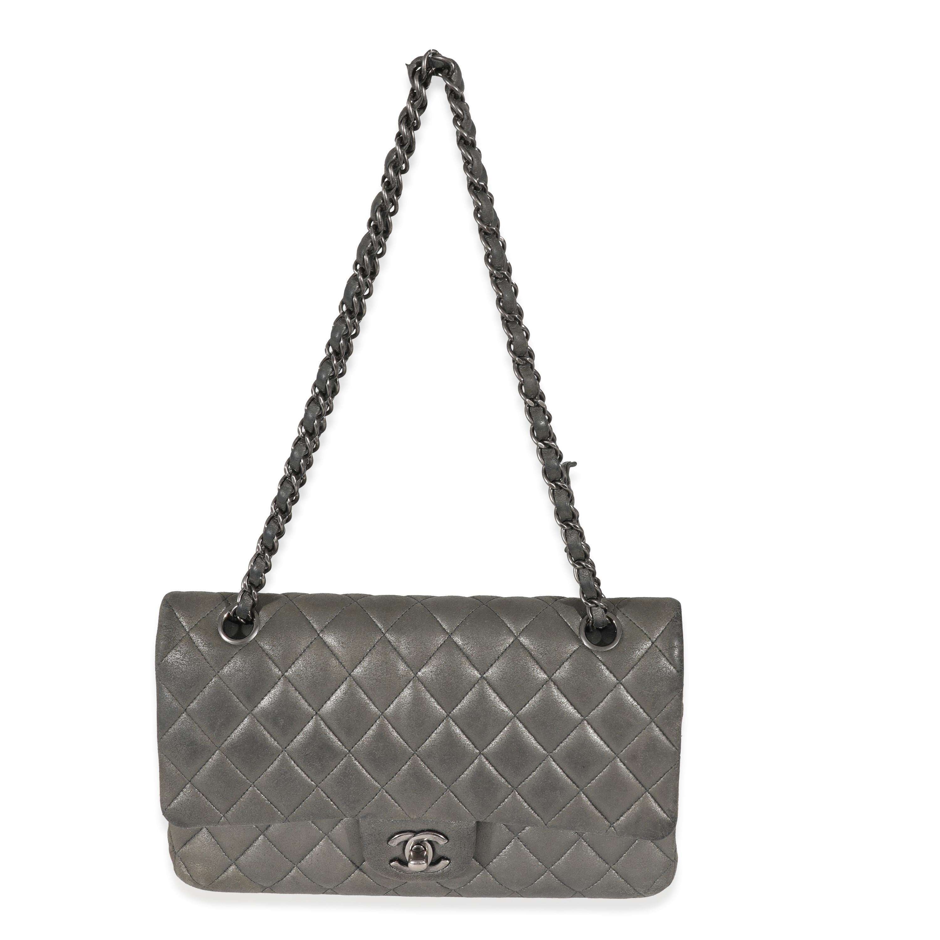 Listing Title: Chanel Grey Metallic Nubuck Medium Classic Double Flap
SKU: 130741
Condition: Pre-owned 
Condition Description: A timeless classic that never goes out of style, the flap bag from Chanel dates back to 1955 and has seen a number of