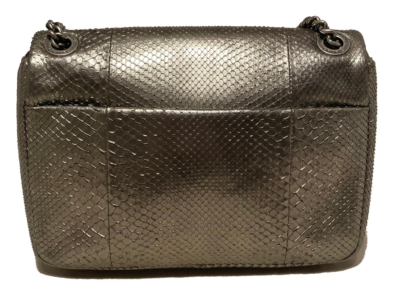 Chanel Grey Metallic Python Shanghai Flap Bag in very good condition. Grey metallic python exterior trimmed with antiqued silver hardware. Silver chain shoulder strap with matching python leather center can be worn short (doubled) or long (single).