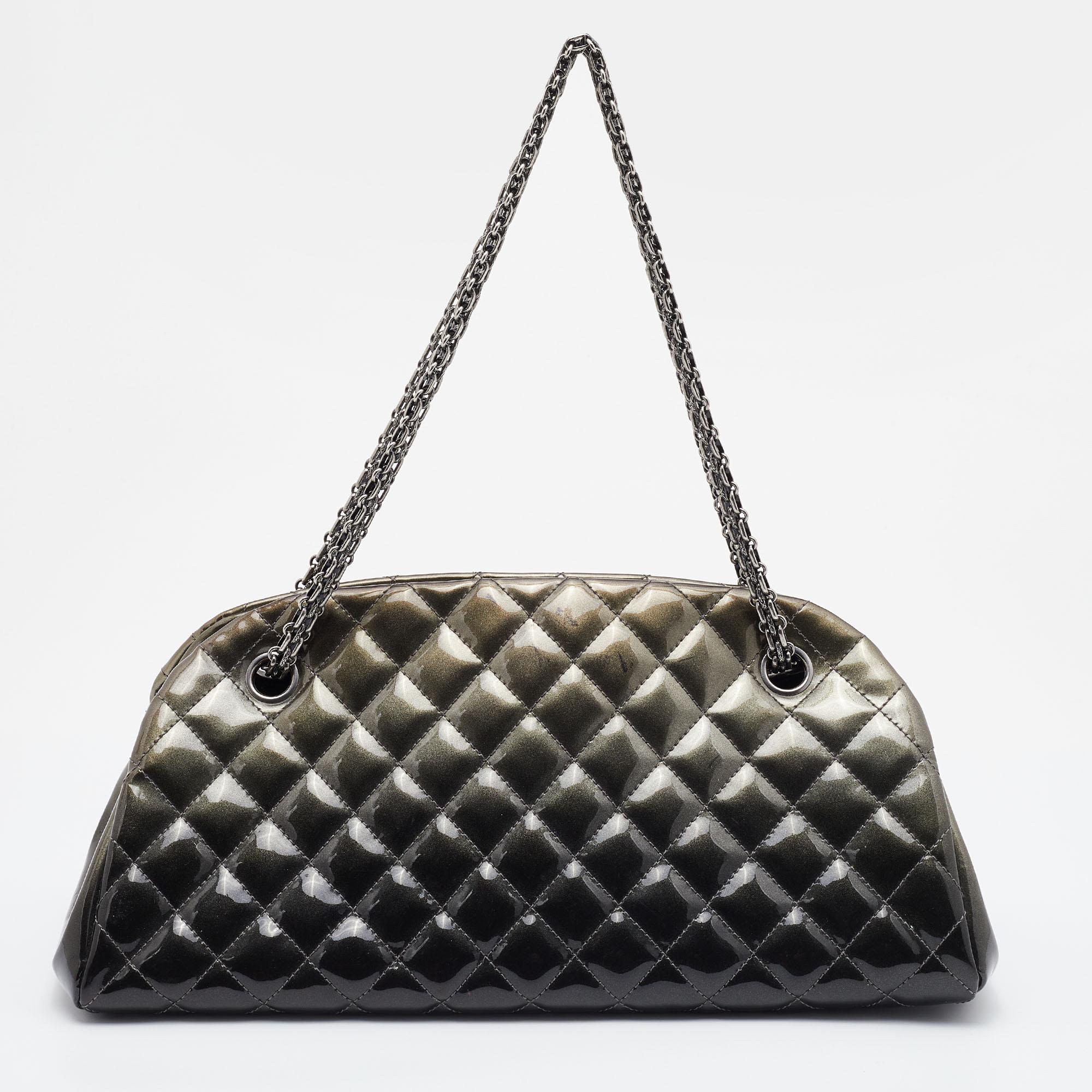 Striking a beautiful balance between essentiality and opulence, this Just Mademoiselle Bowler bag from the House of Chanel ensures that your handbag requirements are taken care of. It is equipped with practical features for all-day ease.

