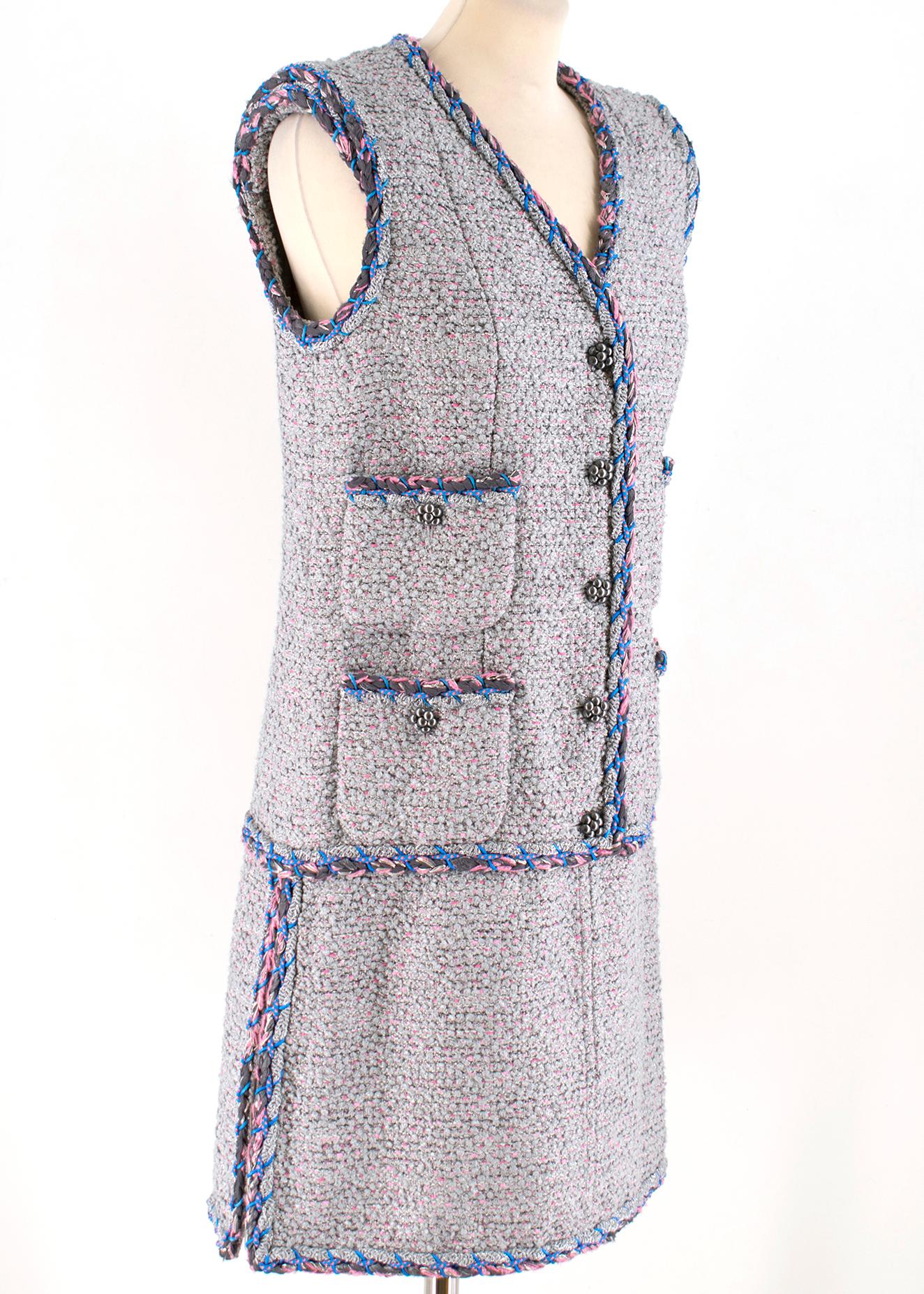 Chanel Grey Metallic Tweed Knit Dress

- Metallic grey tweed dress
- Pink thread knit
- Four front slip pockets 
- Button fastening to the middle front 
- Detail zip fastening to the sides
- V neckline
- Sleeveless
- Silk lining

Please note, these