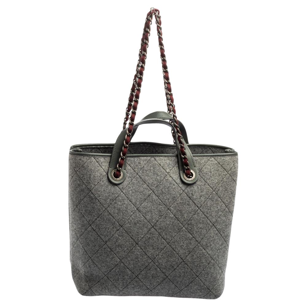 This shopping tote from Chanel is a creation meant to assist you with style and ease. It comes crafted from quilted felt fabric and silver-tone hardware. Two handles are provided for you to carry it and a spacious interior is to house your