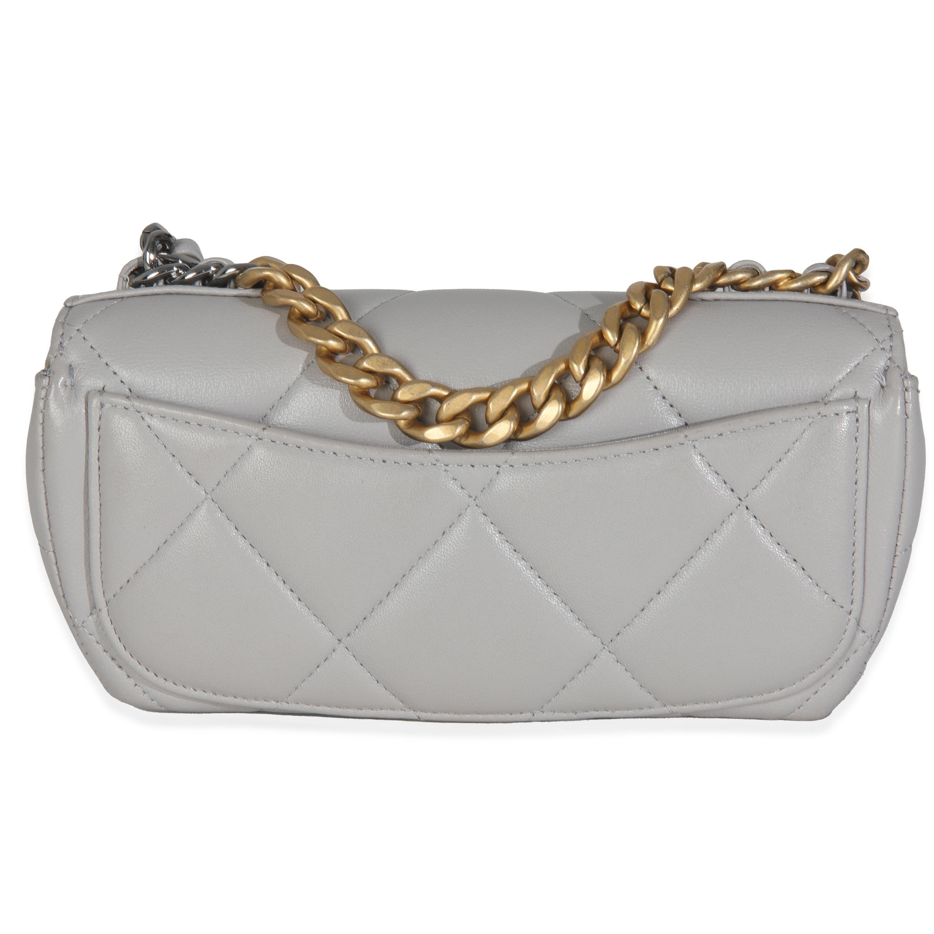 Listing Title: Chanel Grey Quilted Lambskin Chanel 19 Sunglasses Case With Chain
SKU: T146437
Condition: Pre-owned 
Handbag Condition: Excellent
Condition Comments: Item is in excellent condition and displays light signs of wear.   Light scuffing