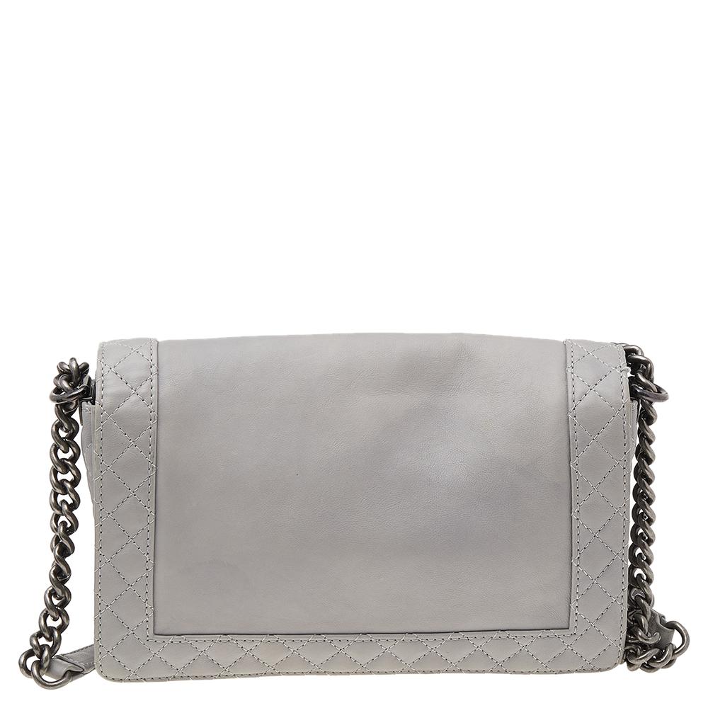 Every Chanel creation deserves to be etched with honor in the history of fashion as they carry irreplaceable style. Chanel's Reverso Boy flap bag was part of the fall/winter 2013 collection. This stunning bag is made from grey leather and has an