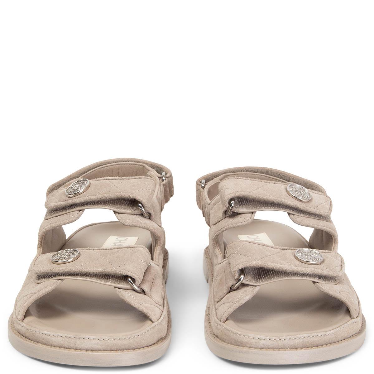 100% authentic Chanel Dad Sandals in light grey quilted suede featuring velcro closure and silver-tone CC logo buttons. Brand new. Come with dust bag and box. 

Measurements
Model	Chanel22P
Imprinted Size	39C
Shoe Size	39
Inside Sole	25.5cm