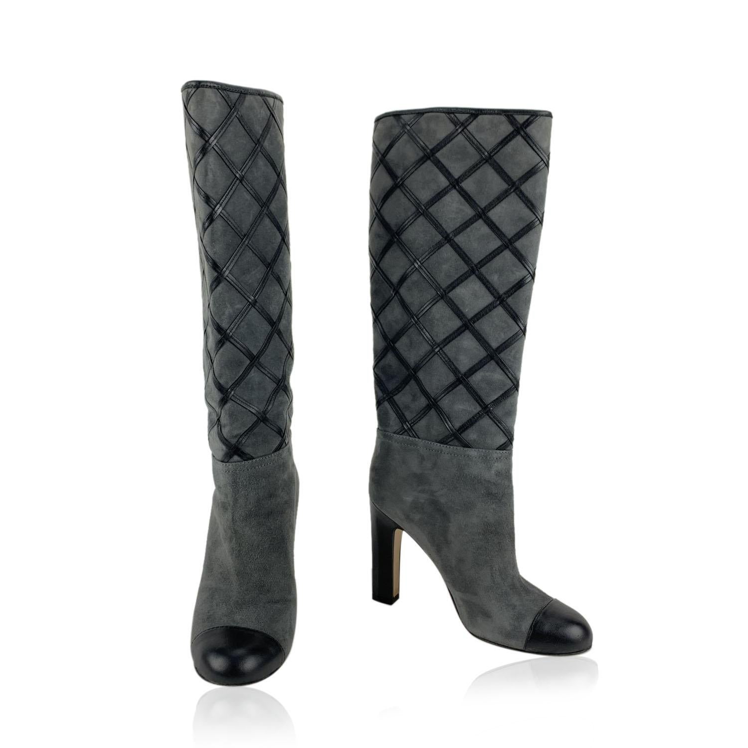 Beautiful Chanel Knee-High Boots in grey color. Crafted in suede with genuine leather trim, they feature a round cap toe, pull-on style and covered block heels (with silver metal CC logo detail). Leather diamond quilting on the shaft. Leather sole.