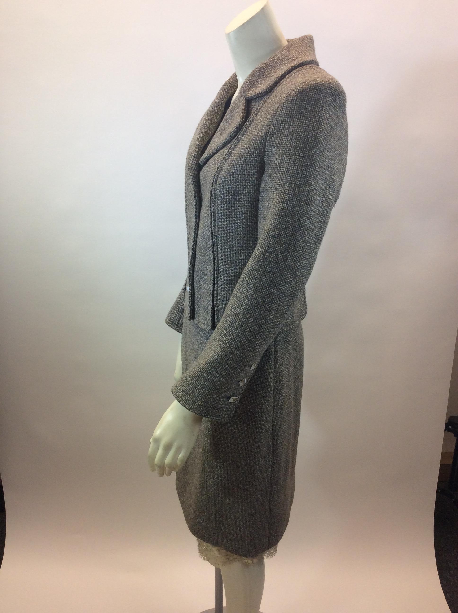 Chanel Grey Tweed Two Piece Skirt Suit
$425
Made in France
100% Wool
Size 38
Jacket:
Length 19