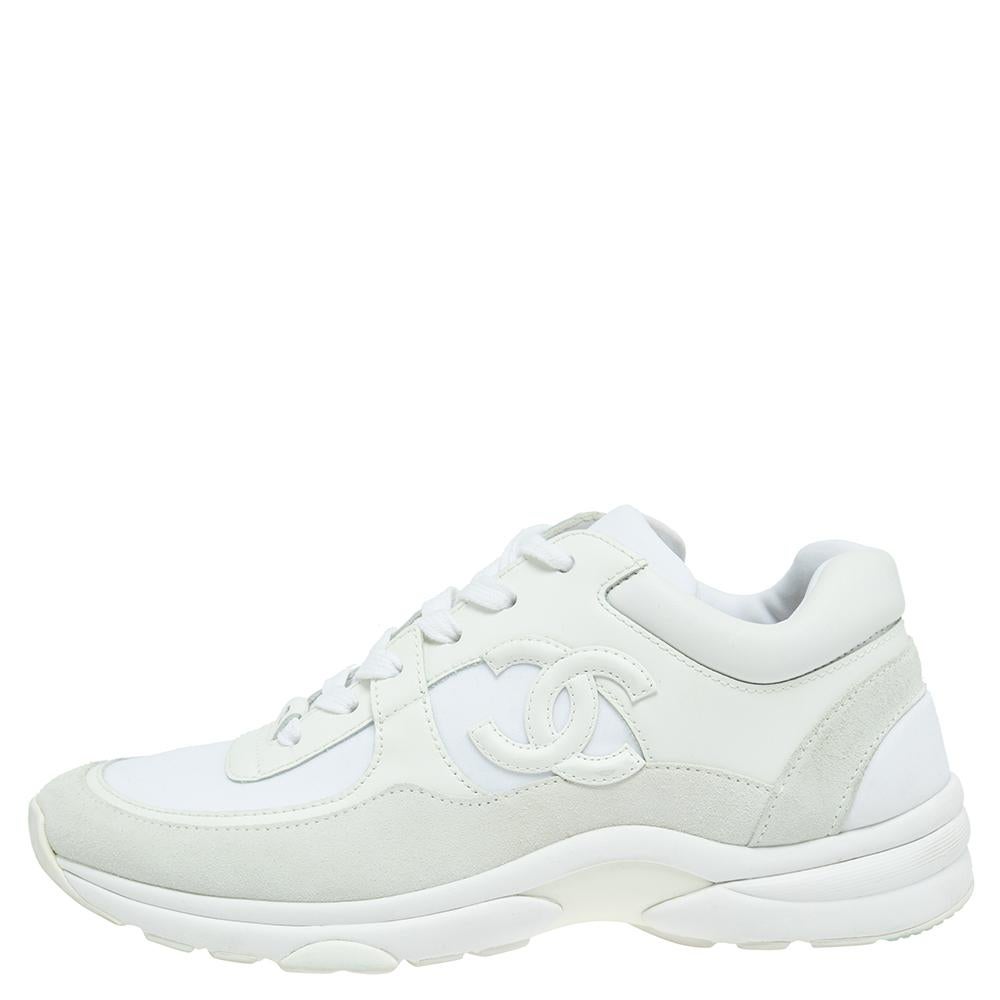 This pair of white Chanel sneakers is a must-have in every fashionista's closet. The shoes are made from suede, leather, and fabric with neat lace-ups, comfortable insoles, and tough rubber soles. Make them yours today!