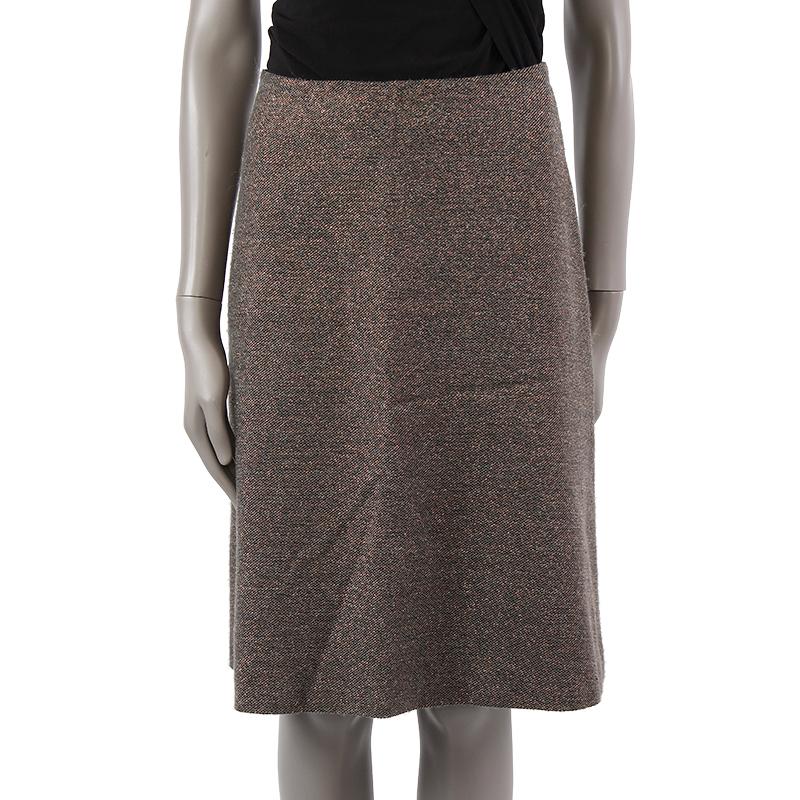 100% authentic Chanel high-waisted skirt in gray wool (probably, as content tag is missing) and bronze lurex. Has been worn and is in excellent condition.

Tag Size	Missing Tag
Size	S
Waist From	68cm (26.5in)
Hips From	102cm (39.8in)
Length	62cm