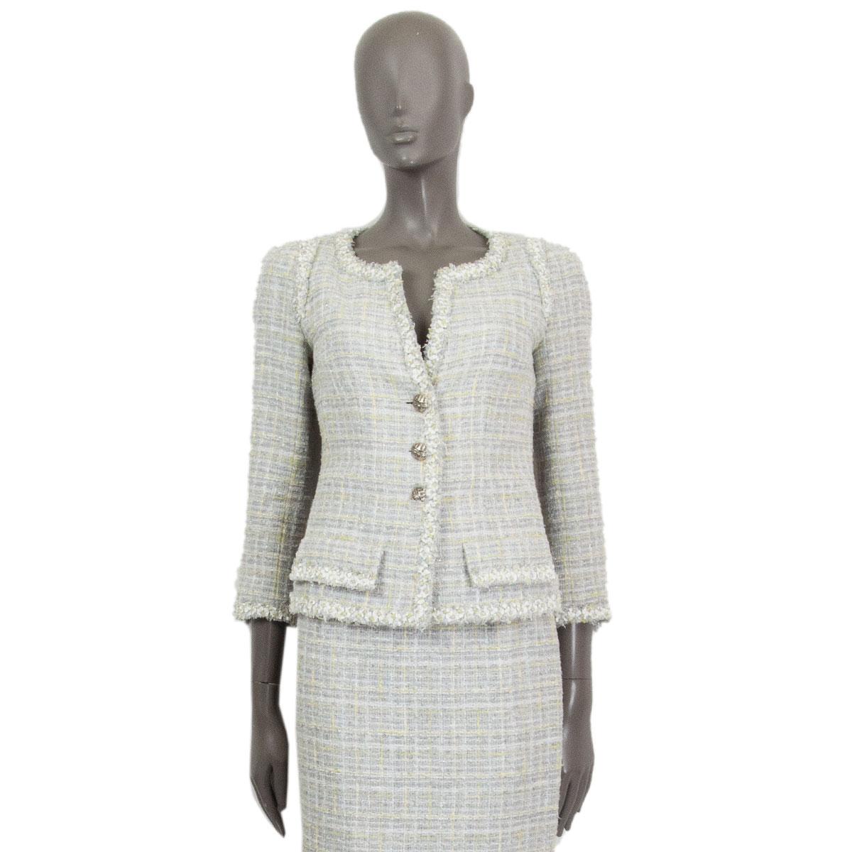 100% authentic Chanel buttoned boucle jacket in light grey, white, lime cotton (56%), wool (19%), rayon (18%), nylon (6%) and polyester (1%) with embroidery at the collar, front-hem, bottom-hem and cuffs. Closes with three logo embossed buttons on