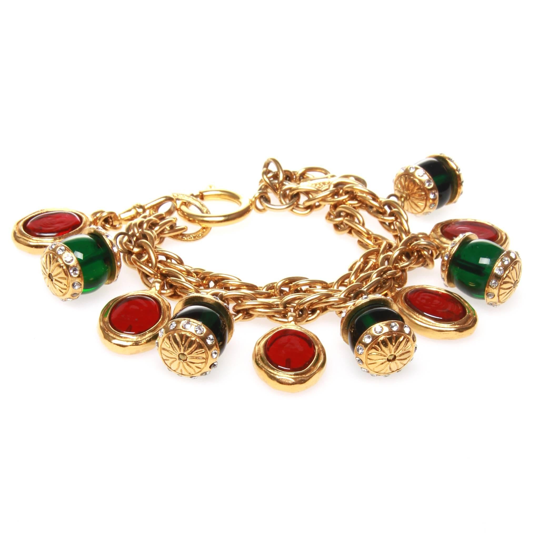 Vintage Chanel charm bracelet formed of two chains strung with red and green gripoix glass beads encrusted with crystals. Spring ring clasp and stamped plate on chain.