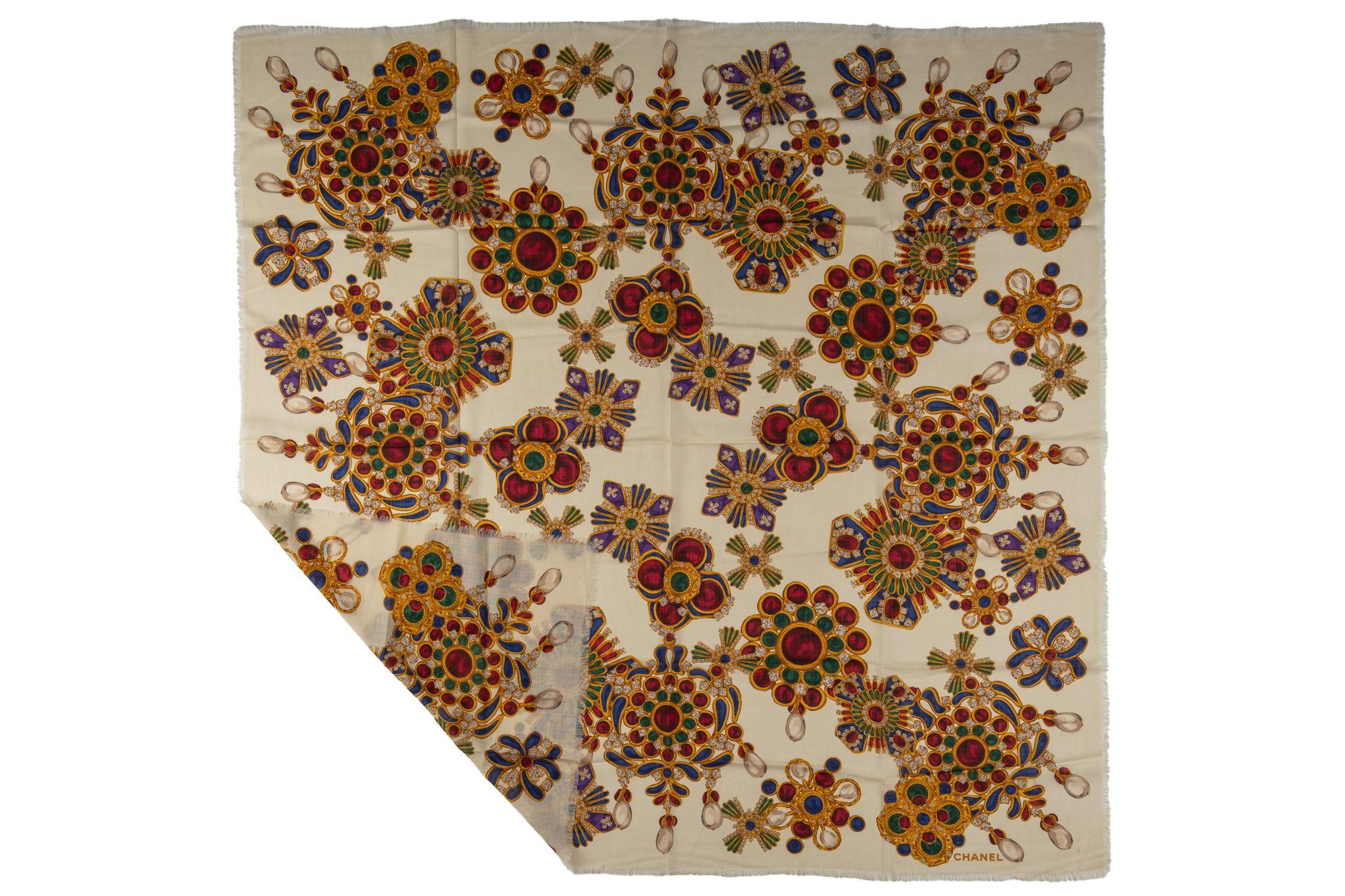 This Chanel Gripoix jewellery-print scarf features logo print to the front, finished edge, beige/multicolour and Gripoix jewellery print. Minor stains, please refer to photos. 80s collection in wool. 
Box not included.
