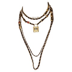 Chanel collana a più fili con catena in pelle Gripoix in oro 2020