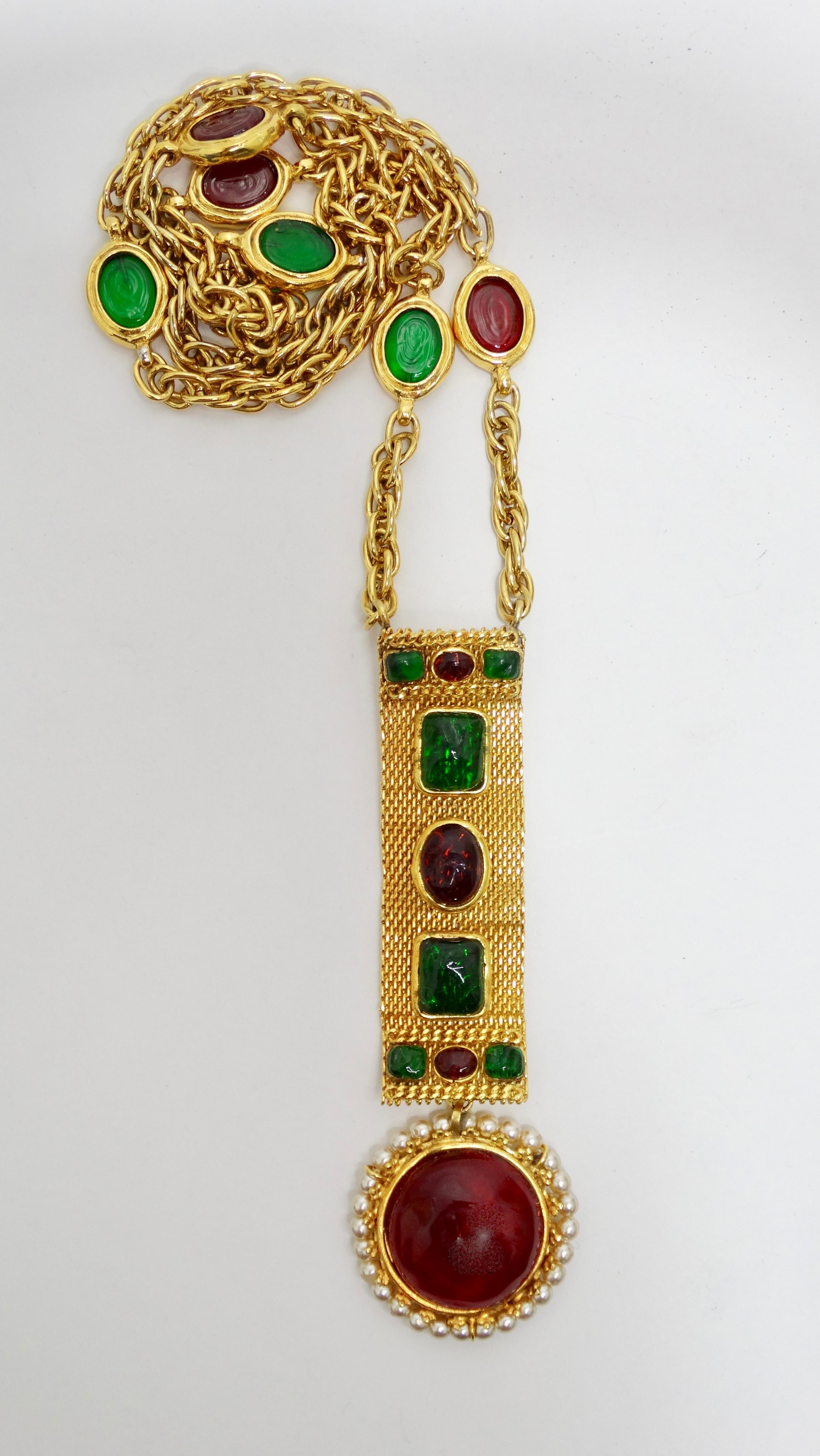 For the love of Chanel! Circa 1994 from their Autumn collection, this gold plated necklace features emerald green and ruby red Gripoix with a double link chain and a decorated metal mesh piece. Hanging from the mesh is a large Gripoix pendant framed