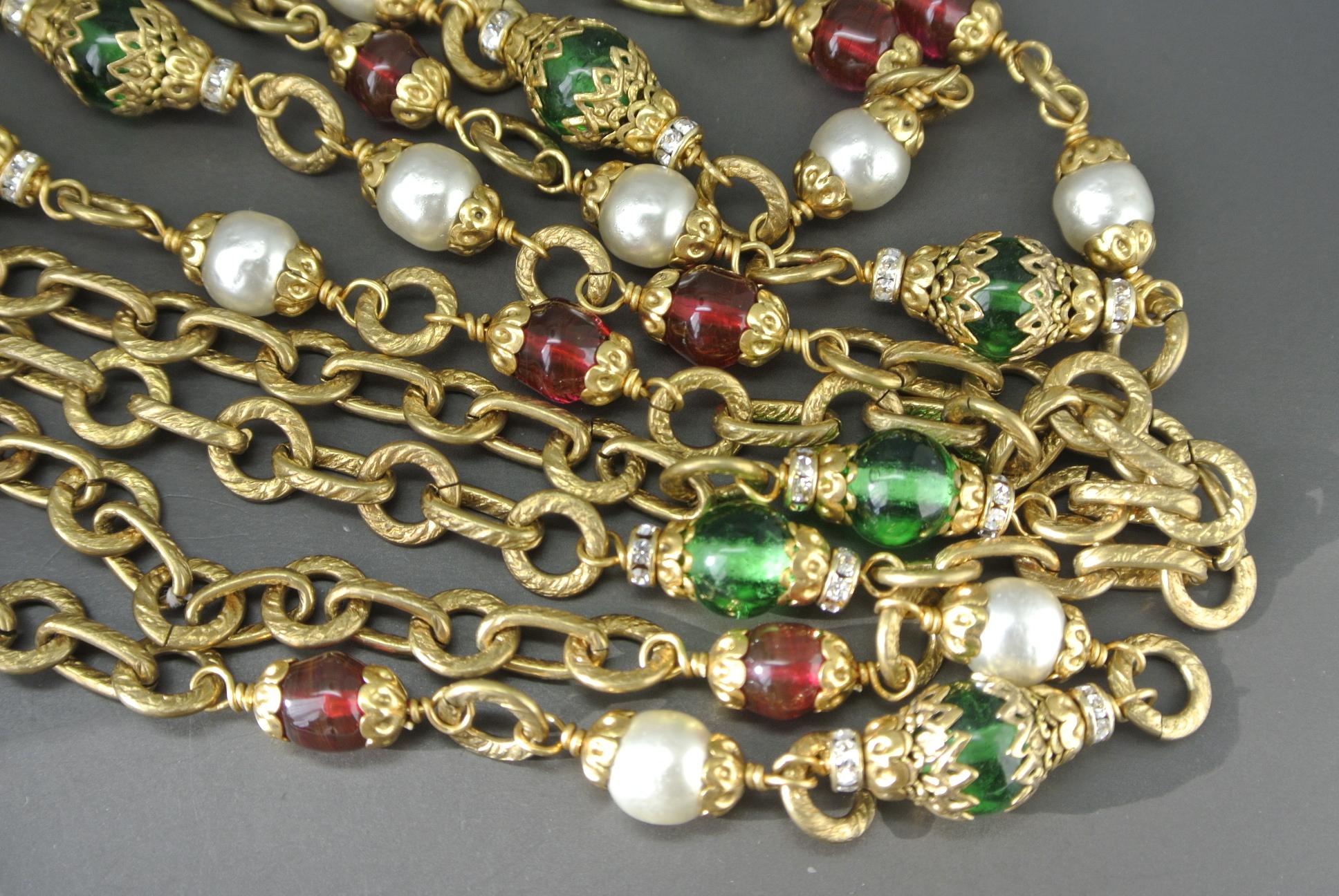 Chanel necklace
Made with poured glasses beads
capped with filigree 
Dated 70s