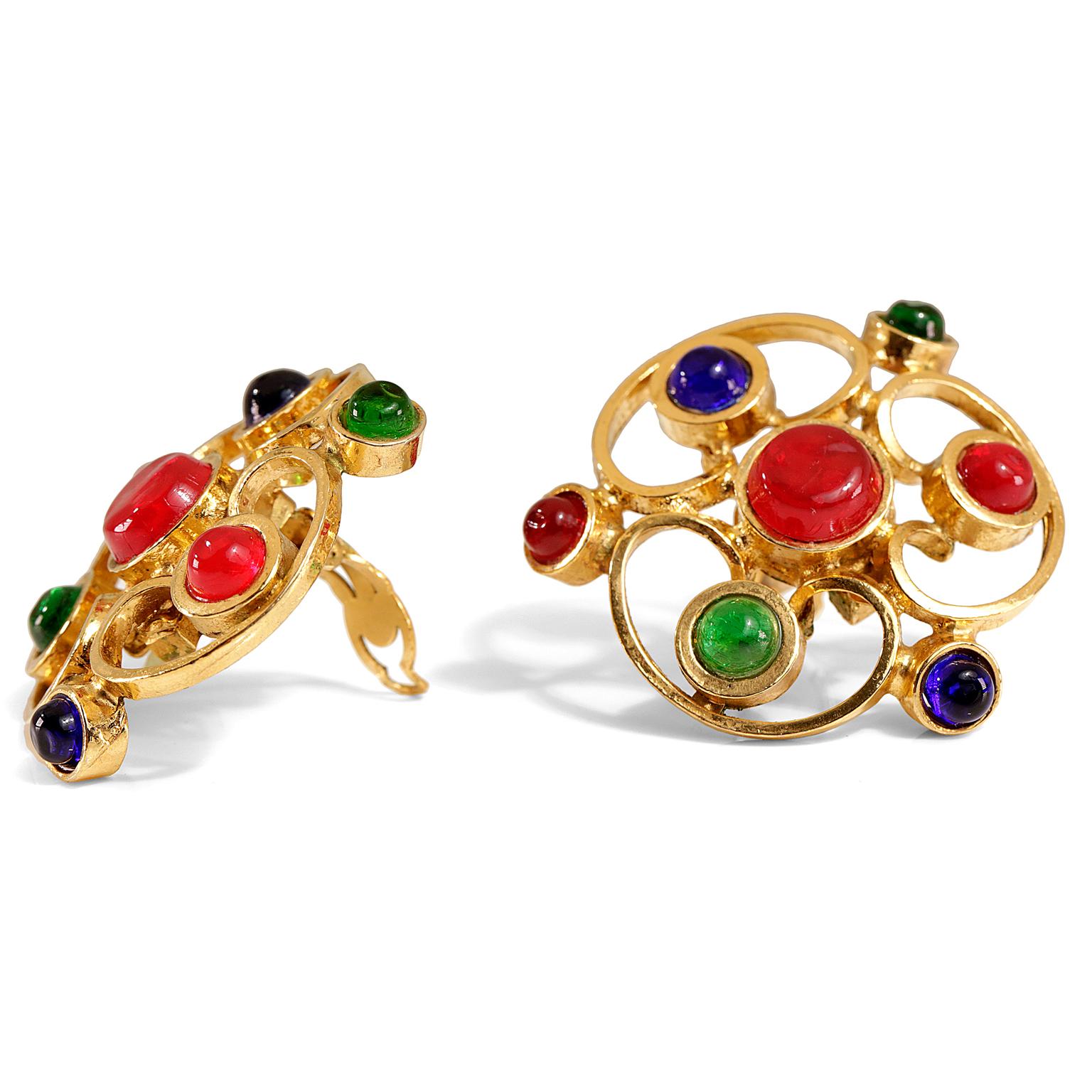Chanel Gripoix Floral Spiral Clip On Earrings- mint condition
Red, green and blue Gripoix stones are arranged in a gold spiral cutout flower large earring.  Clip on closure.  
