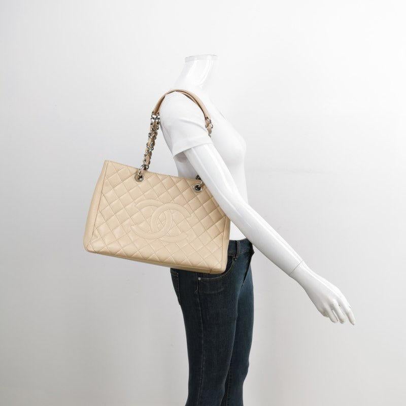 Chanel GST Grand Shopping Tote 2011 Beige Caviar Leather PM
These are professional photos of the actual bag.
  
  Discontinued in 2015, the Grand Shopping tote bag is one CHANEL rarity that is highly treasured. This version displays a classic design