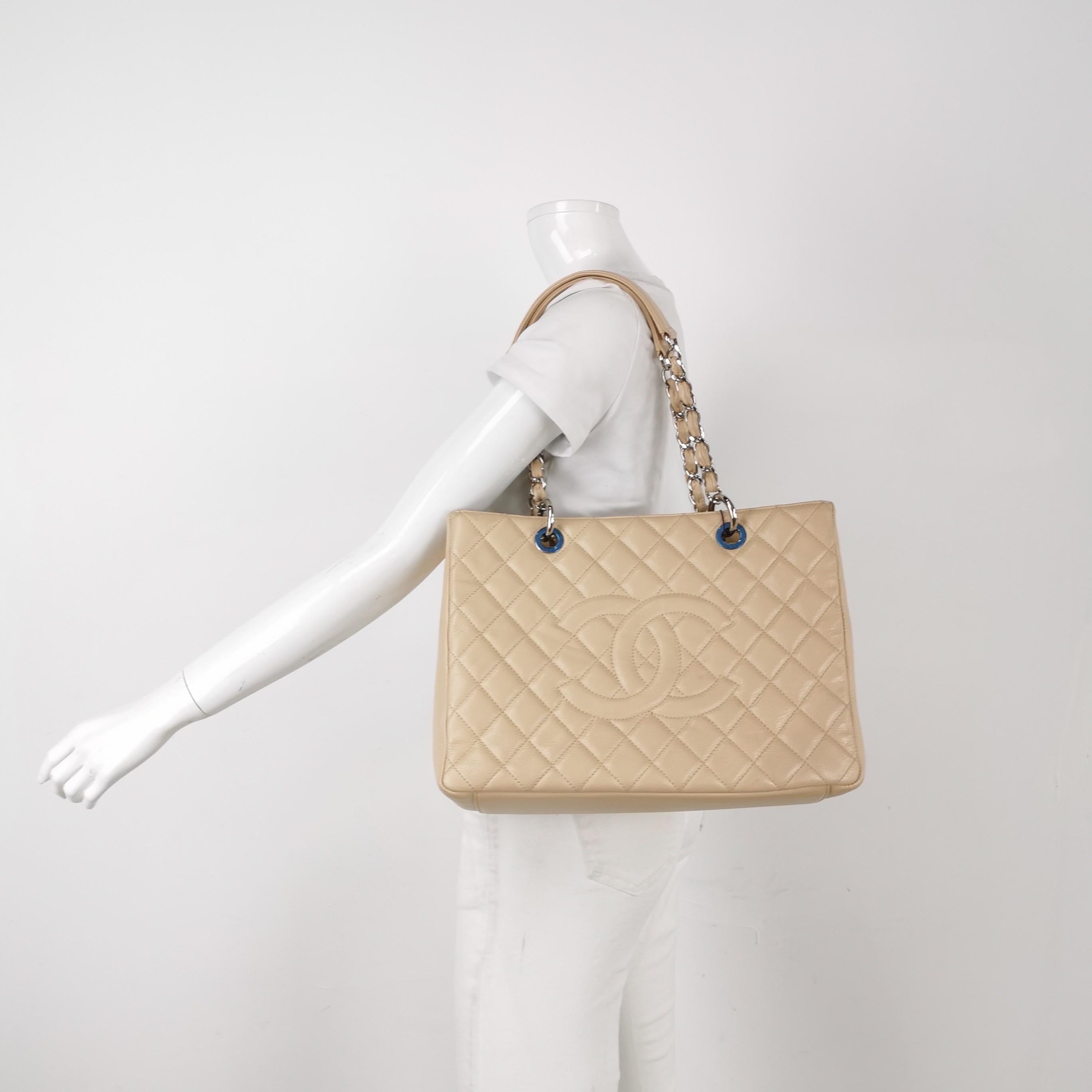 Chanel GST Grand Shopping Tote 2011 Beige Caviar Leather PM
These are professional photos of the actual bag.
  
  Discontinued in 2015, the Grand Shopping tote bag is one CHANEL rarity that is highly treasured. This version displays a classic design