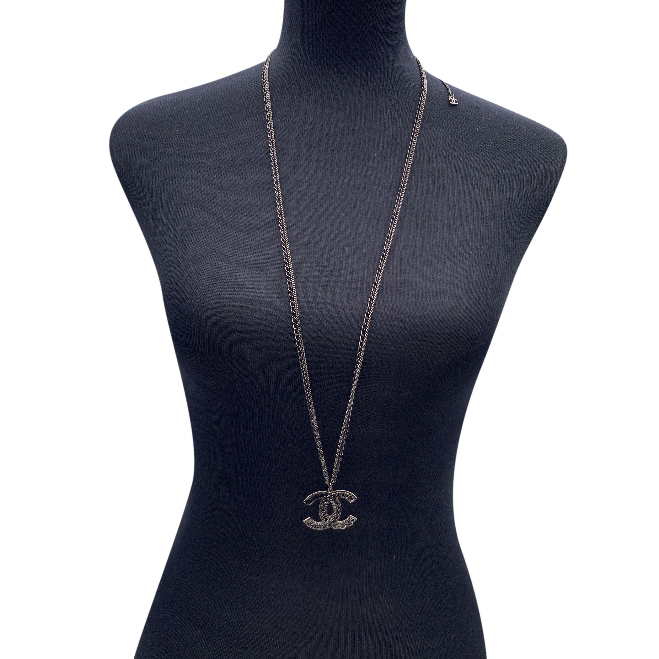 Lovely Chanel necklace with gunmetal double chain. It features a CC logo pendant with chain detailing on it. Lobster closure. Small CC logo charms at the end of the necklace. Total length of the chain: 35 inches - 88.9 cm. 'CHANEL 09 CC P - Made in