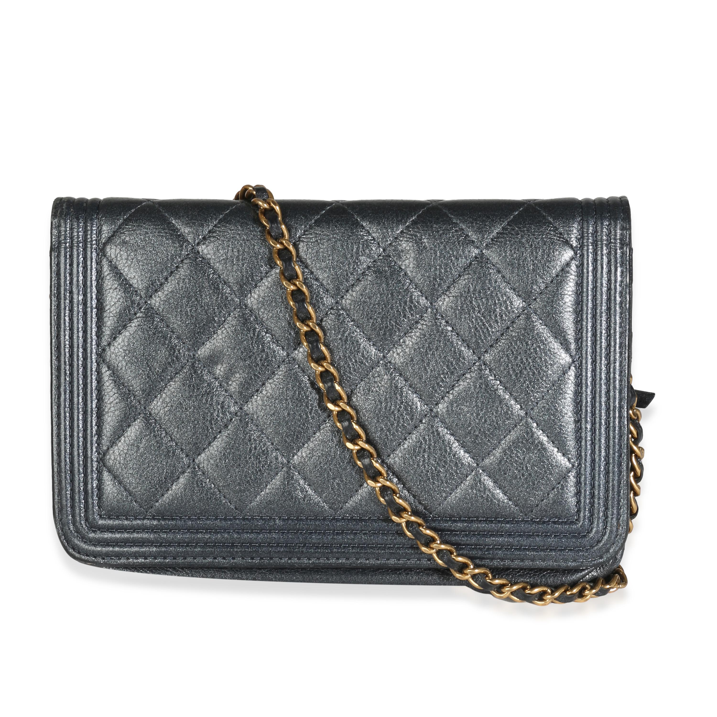 Listing Title: Chanel Gunmetal Quilted Lambskin Boy Wallet On Chain
SKU: 142564
Condition: Pre-owned 
Condition Description: An instant classic, the Boy bag from Chanel was introduced in 2011. The quilted bag was designed by the late Karl Lagerfeld,