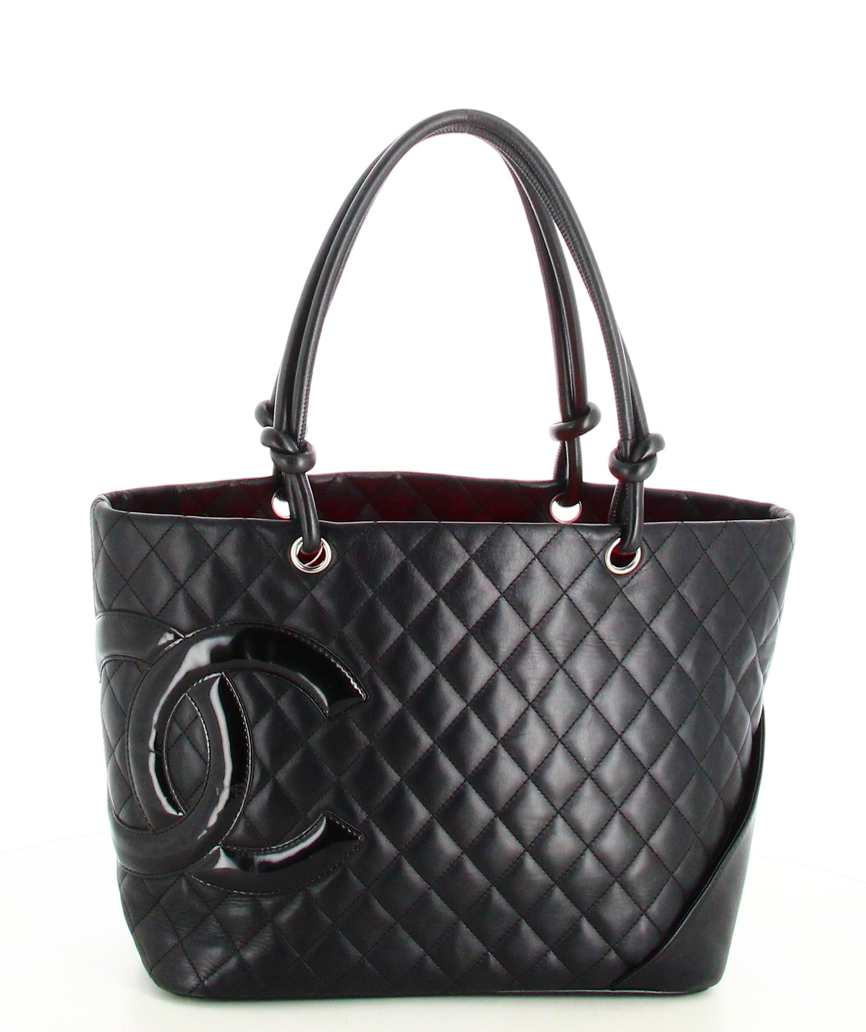 Chanel Handbag Black Leather Large Quilted Cambon Tote Line

- Good condition. Shows very slight signs of wear over time.
- Chanel Handbag
- Black quilted leather
- Two black leather handles
- Inside: pink monogram lining plus inside pocket