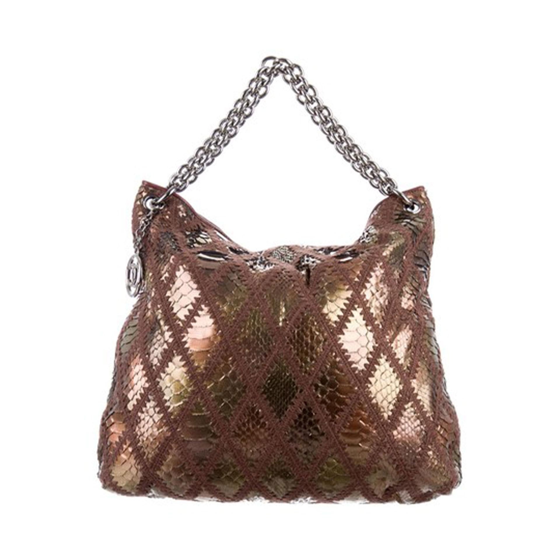 Chanel Rare Exotic Python Metallic Bronze Large 2 in 1  Tote & Clutch

2006 {VINTAGE 16 Years}

Silver hardware
Metallic bronze python 
Diamond stitch brown crochet  
Thick chain handle
Magnetic snap closure 
Lambskin leather at interior top
Satin