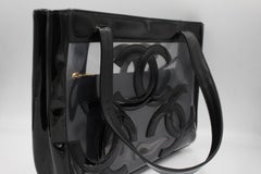 Chanel handbag in black and transparent vinyl.