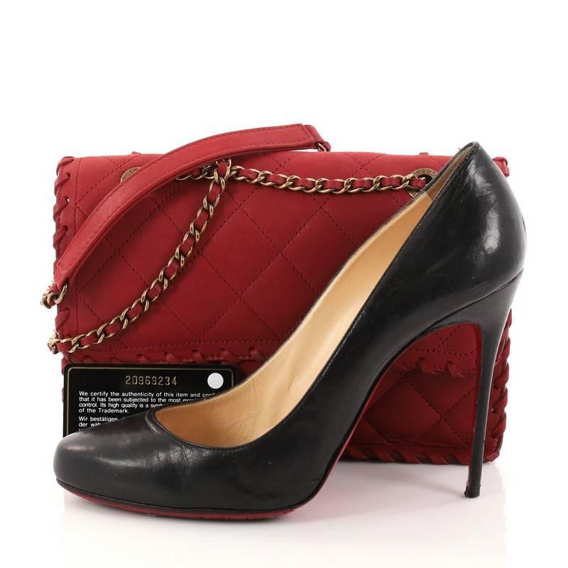This authentic Chanel Happy Stitch Flap Bag Quilted Velvet Calfskin Small is a romantic essential made for any modern woman. Crafted in dark red velvet calfskin leather, this updated flap bag features woven-in leather aged gold chain strap with
