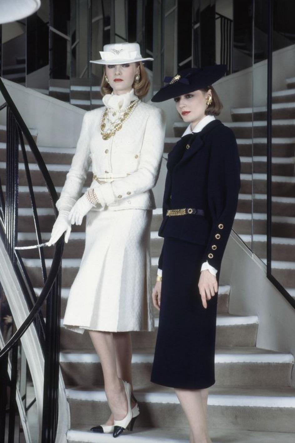 Exceptional and iconic ecru tweed skirt suit from the Chanel Haute Couture Fall/Winter 1983 collection—the first collection designed by Karl Lagerfeld for Chanel. This is a historical and museum-worthy piece, ideal for serious collectors. The suit