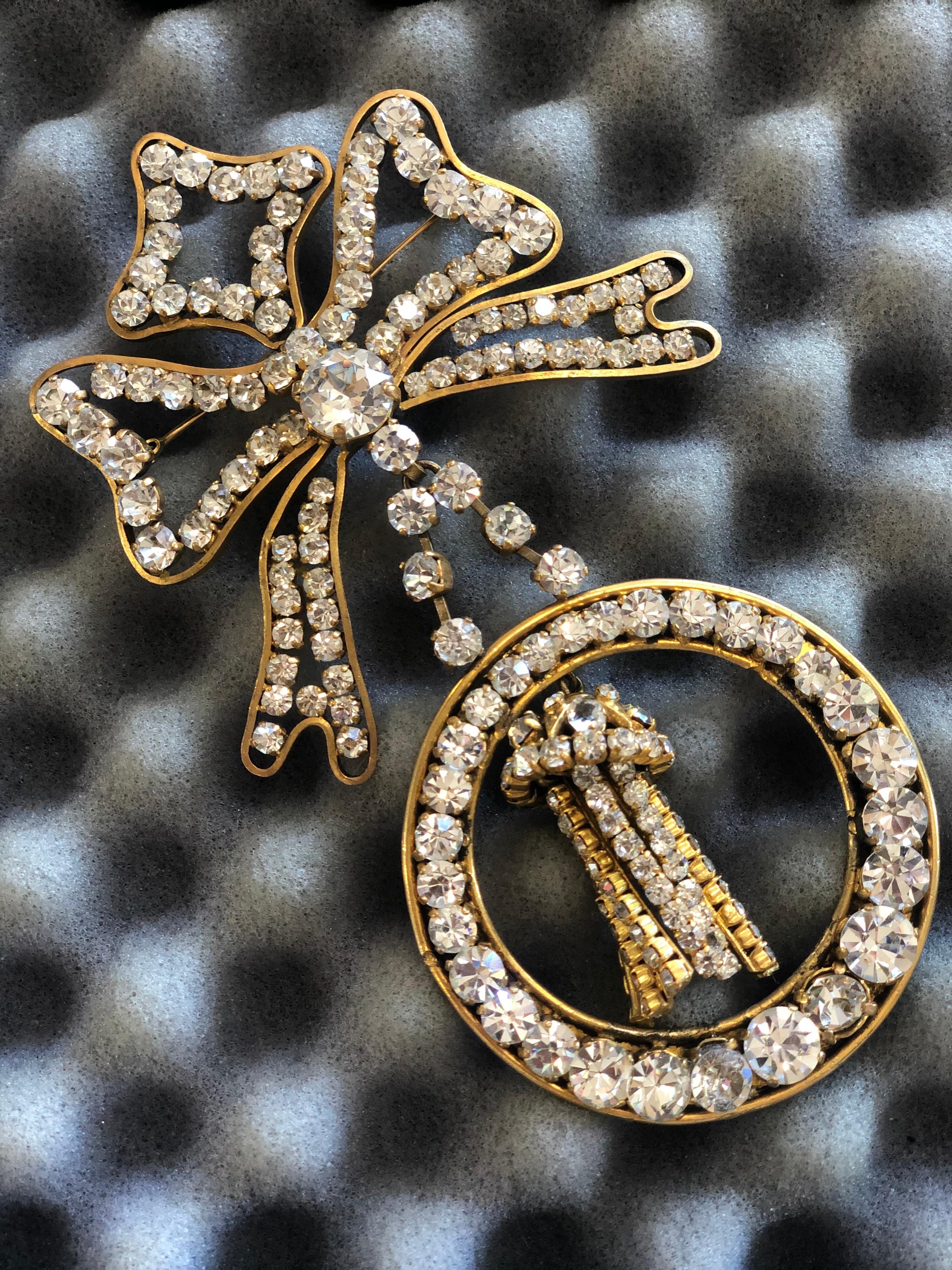 For the Chanel lover who doesn't want the CC's! Circa 1984/1985 and crafted by Victorie de Castellane, this haute couture brooch is from Chanel's 23rd collection. A bow shape with a hanging tassel, this brooch is gold plated and embellished with