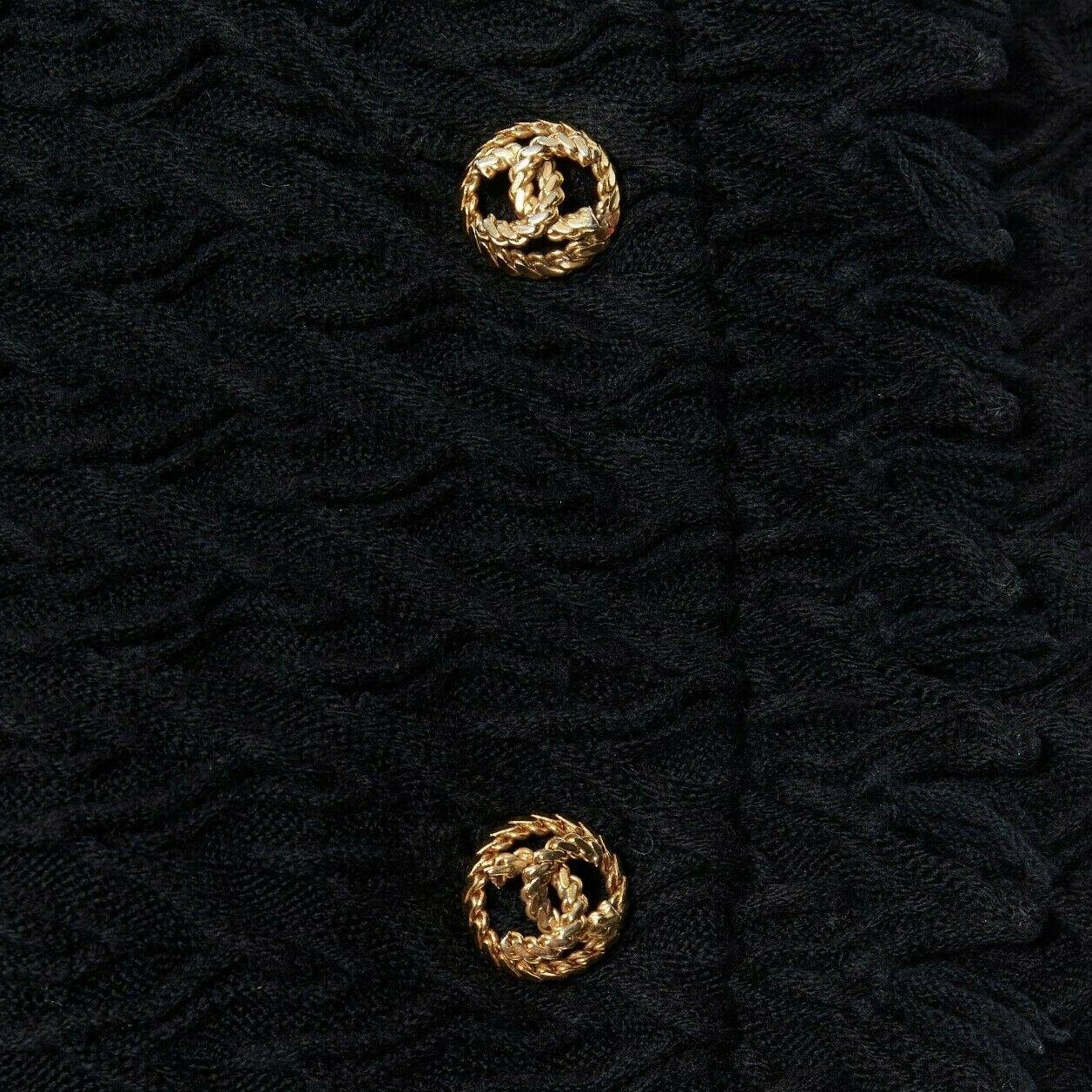 CHANEL HAUTE COUTURE chevron knit gold button high neck fray little black jacket
Brand: CHANEL
Designer: Karl Lagerfeld
Collection: Haute Couture
Model Name / Style: Couture jacket
Material: Other; composition label not present. Feels like