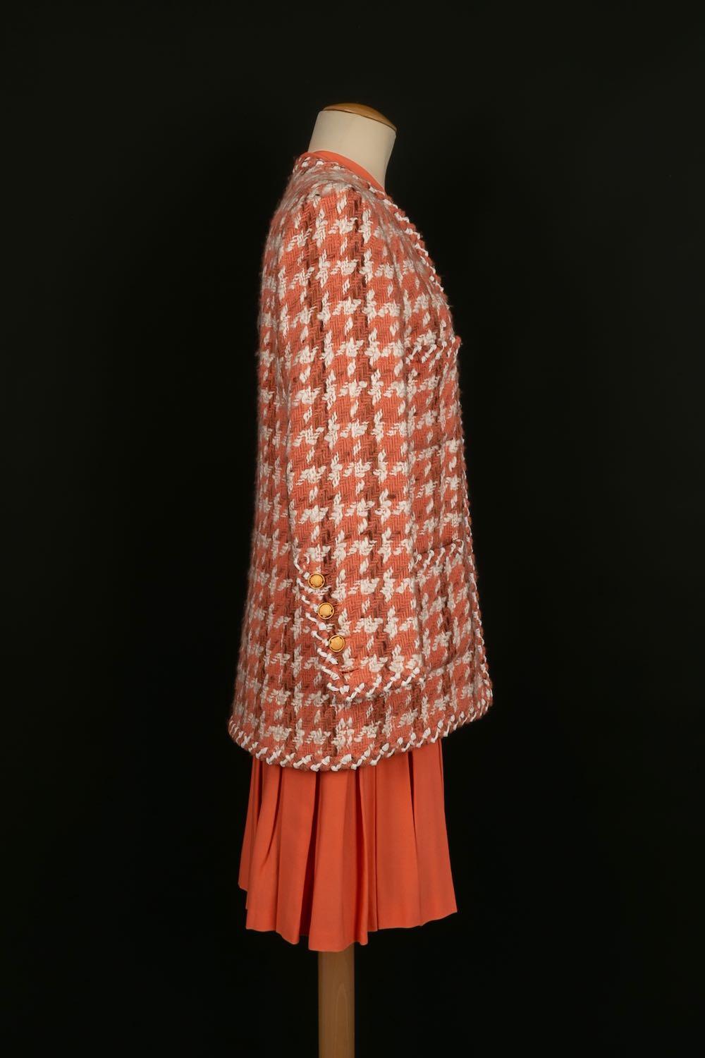 Chanel - (Made in France) Haute Couture three-piece set consisting of a wool tweed jacket and skirt and an orange silk and tweed pleated top and skirt. No size label, it fits a 40FR. 
Spring-Summer 1990 collection.

Additional information: