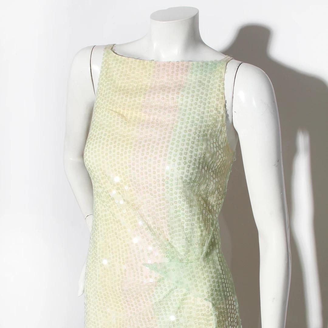 Chanel Haute Couture by Karl Lagerfeld Drop Waist Gown
Haute Couture Spring / Summer 1998
Made in France 
Green, Yellow and Pink Chiffon 
The fabric is covered in iridescent hand stitched sequins
Bias cut silhouette 
Sequins are square 
Square open