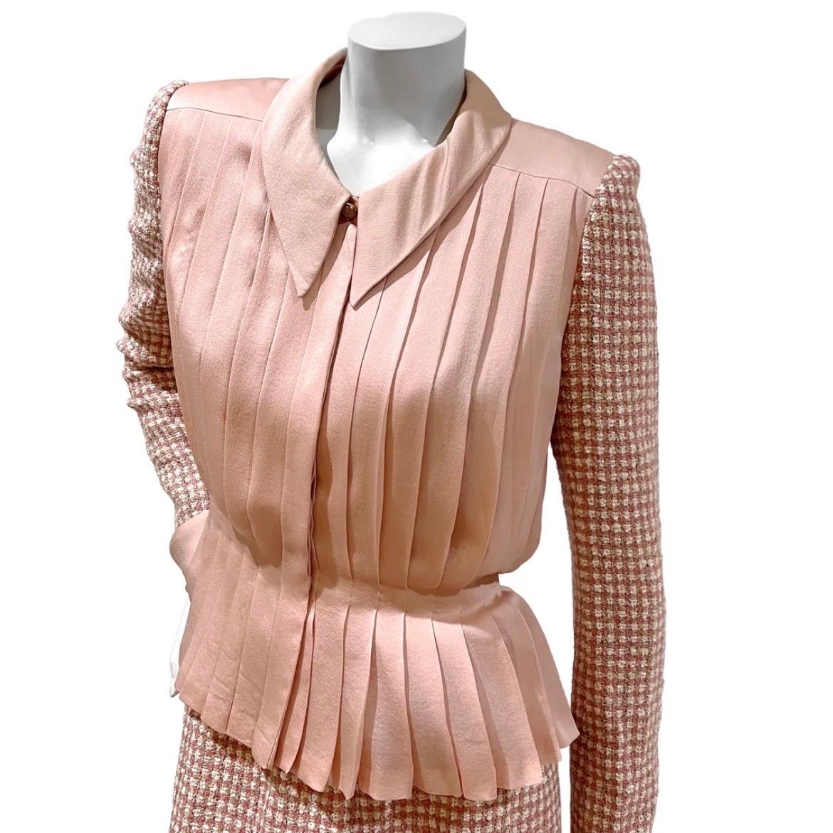Vintage Haute Couture Skirt Suit by Chanel
Circa Late 1970's / Early 1980's
Pink, white, tan, and silver sparkle tweed  
Jacket: 
Flat collar
Light pink pleated silk bodice
Tweed sleeves
Hidden front button closure with decorative faux top button at