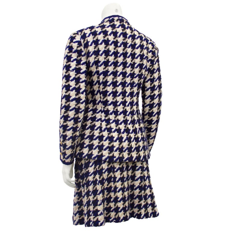 Stunning Chanel haute couture ladies suit in a oversized houndstooth woven wool. Navy, cream with touch of tan finished with navy piping along the Mandarin style collar, down  the front and along the cuffs. The jacket is lined in channel quilted