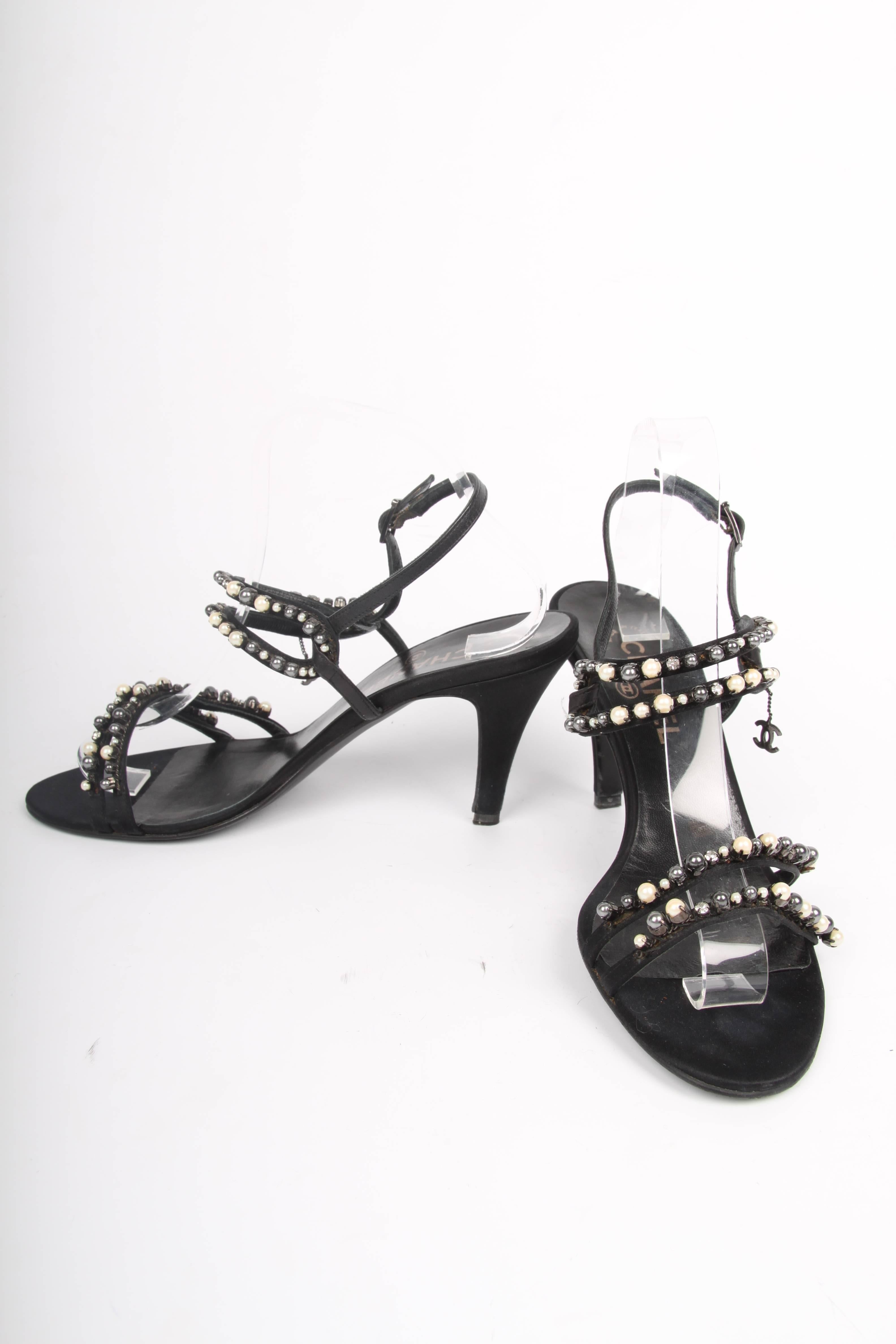 Very pretty sandals by Chanel, these are adorable!

The heel measures 10 centimeters, no platform. Four strap in total cross the foot; all embellished with pearls in different sizes and colors and a crystal here and there. A CC logo dangle on one
