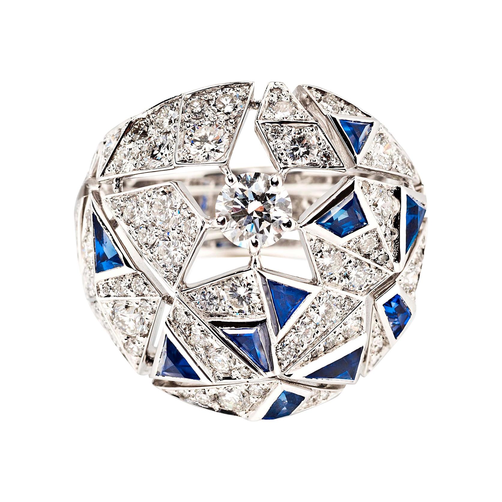 Inspired by the 1920s and the glittering habitués of Parisian nightlife, Chanel blends Art Deco elegance with all out glamour in this one-of-a-kind diamond and sapphire cocktail ring. A central diamond is surrounded by negative space that forms an