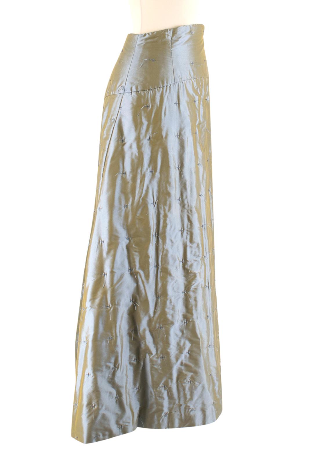 Chanel High Waist Iridescent Feathered Long Skirt 

Silk, grey iridescent quilt skirt, 
Long evening skirt,
High-waisted,
Interior waist cincher and metal zip closure, 
Features side zip, 
Metal Chanel logo on front,
Lined in silk, 
Features a